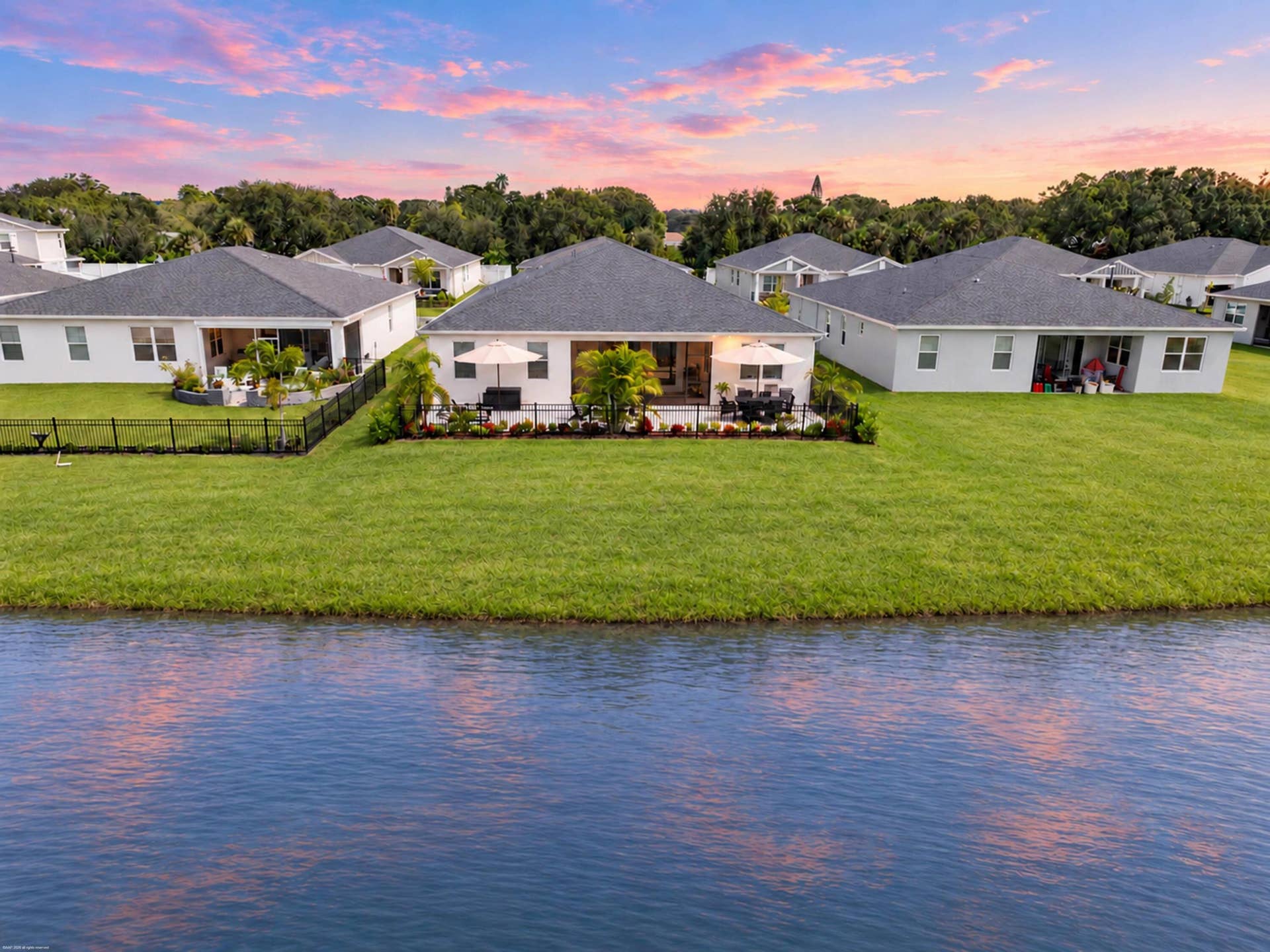 Rear elevation from the lake at dusk