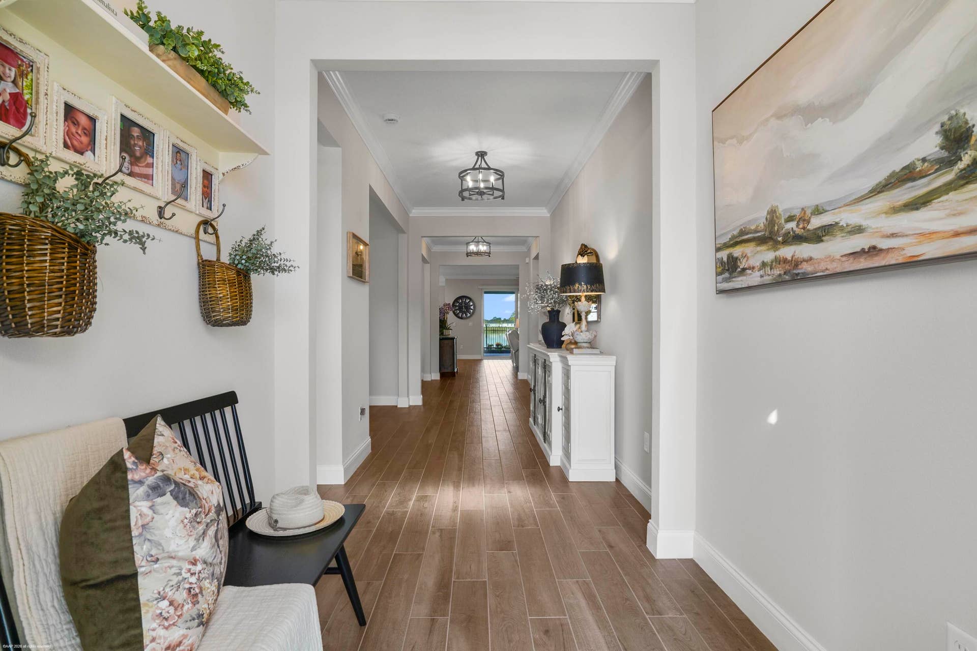 Gallery hallway with wood-look plank flooring