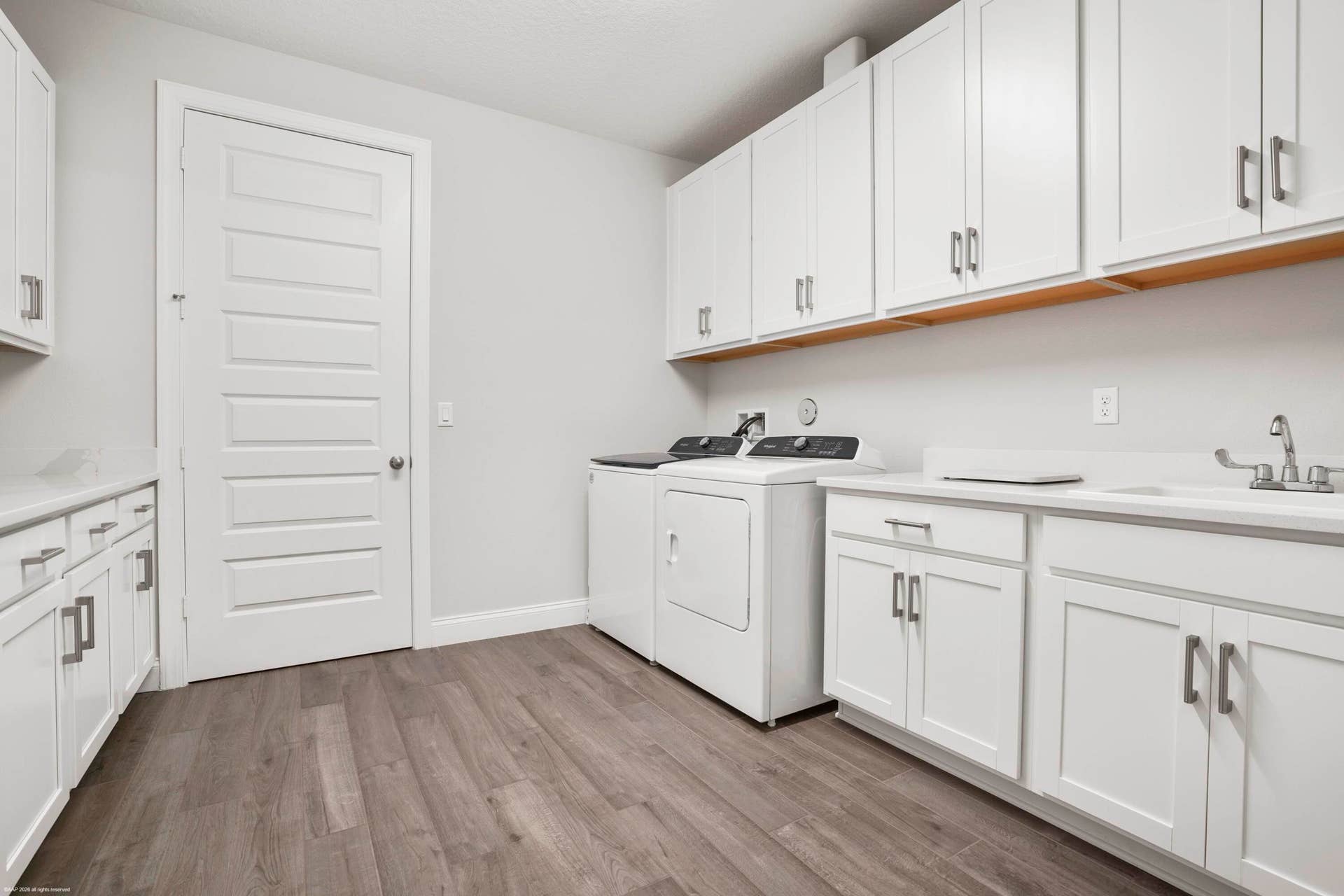 Laundry room with cabinetry and counter space