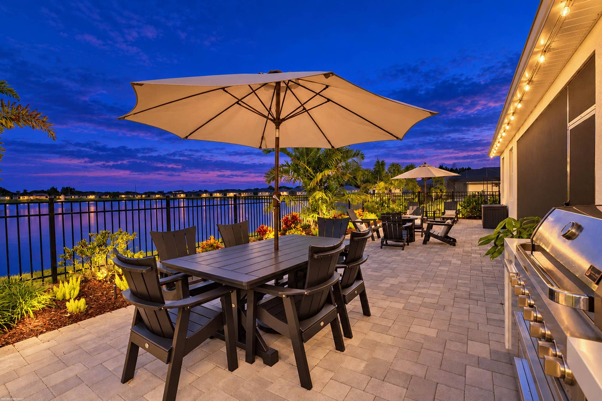 Outdoor dining beneath an umbrella at twilight