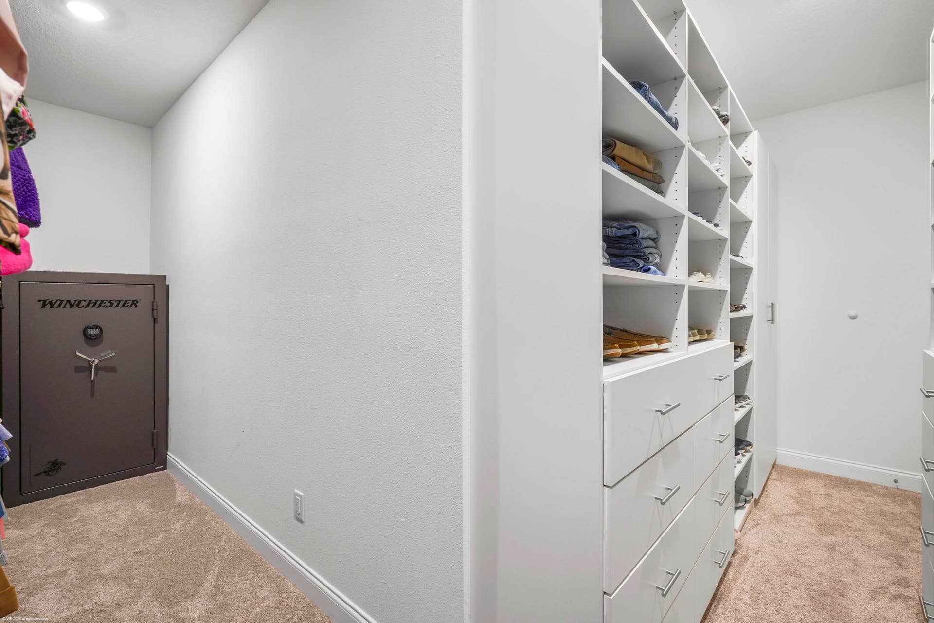 Bedroom closet with custom built-in shelving