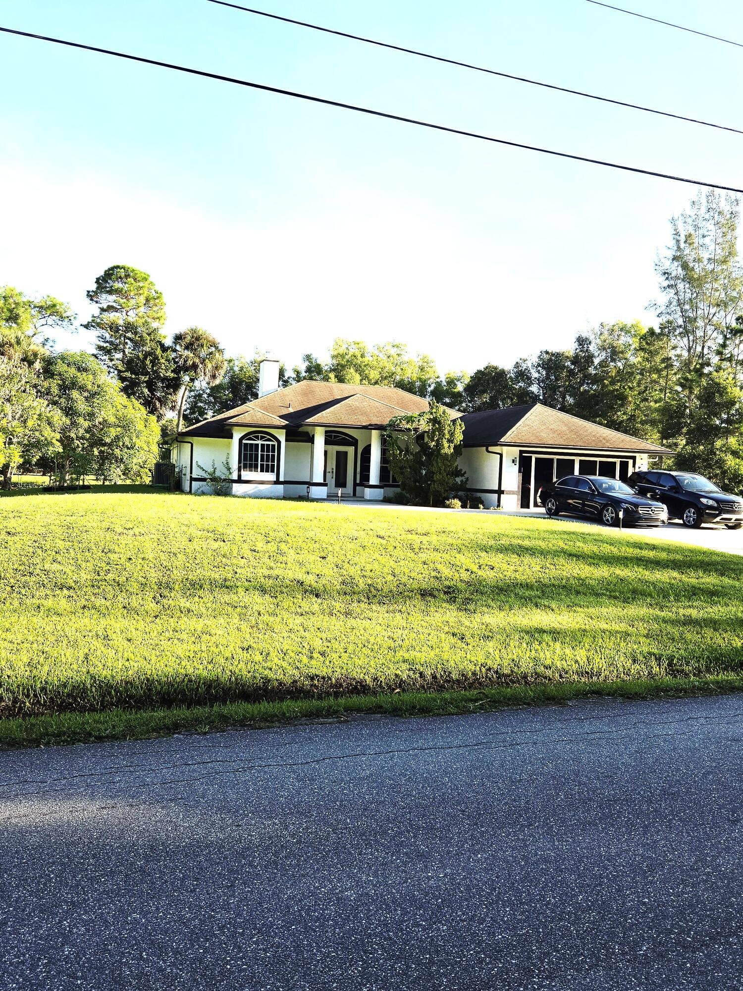 17149 W Alan Black Boulevard, The Acreage, FL 33470 17149 Front of House 2