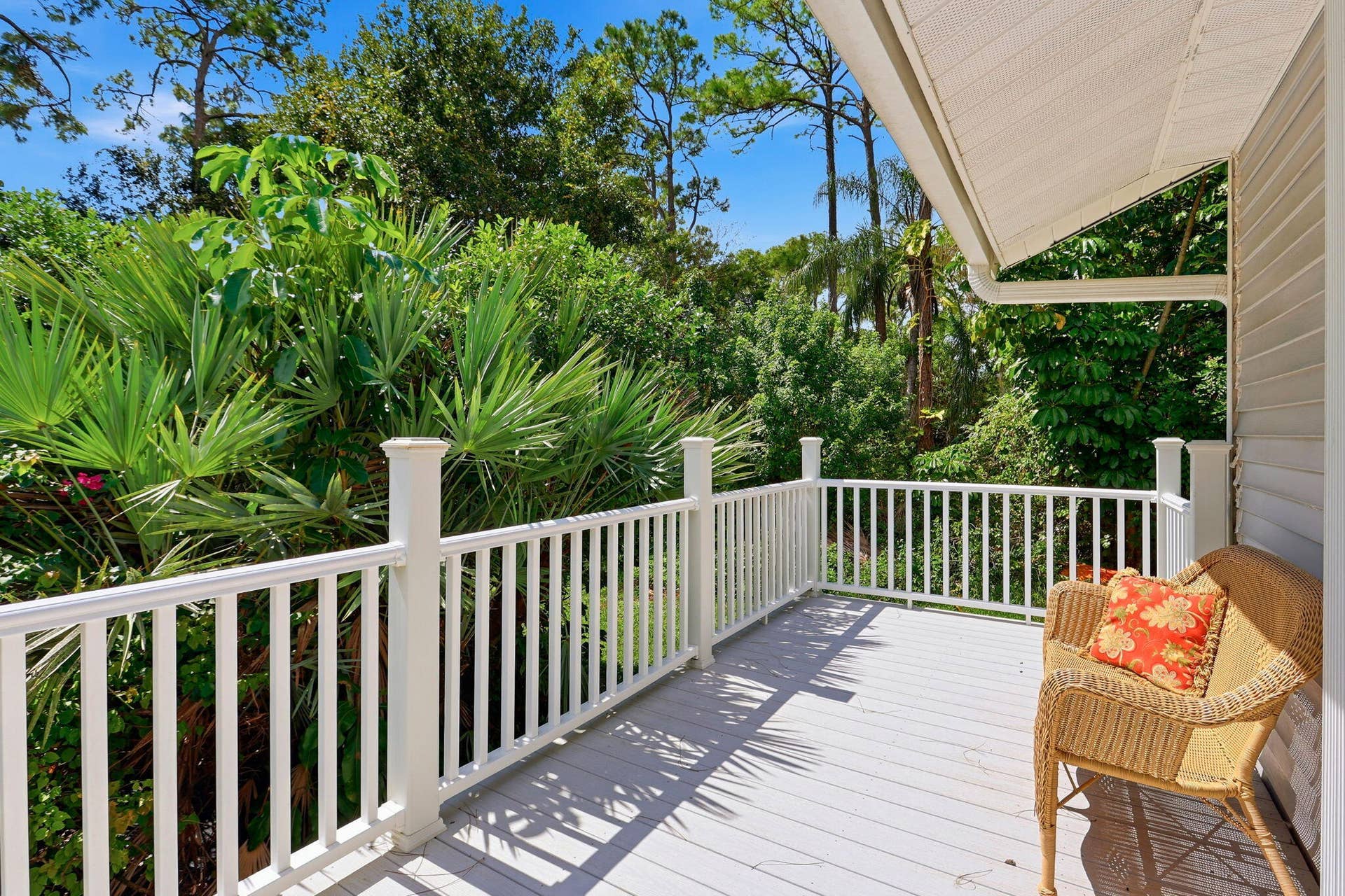 Marine grade composite wood outdoor deck with white railing