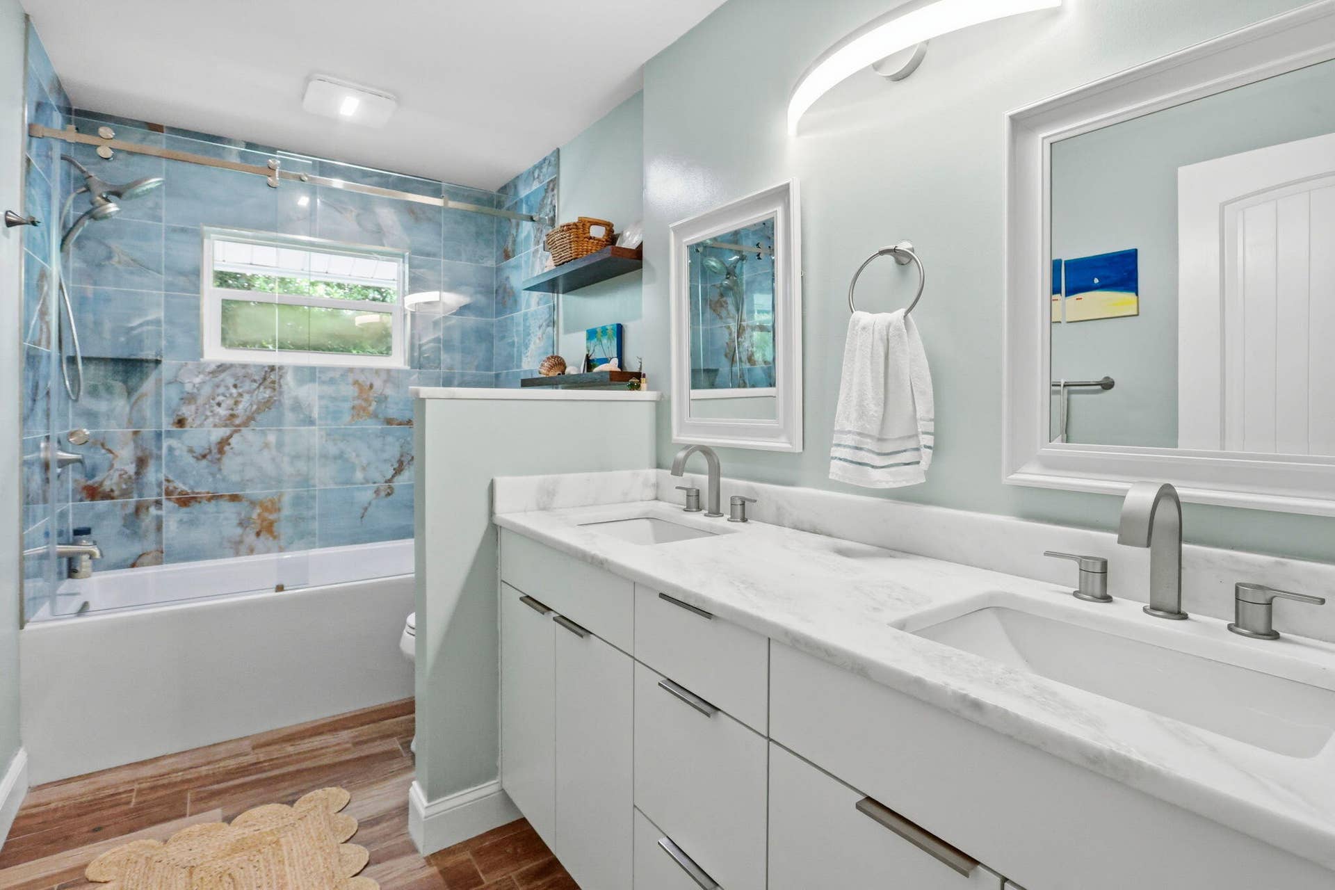 Dual vanity with white cabinetry and integrated sinks