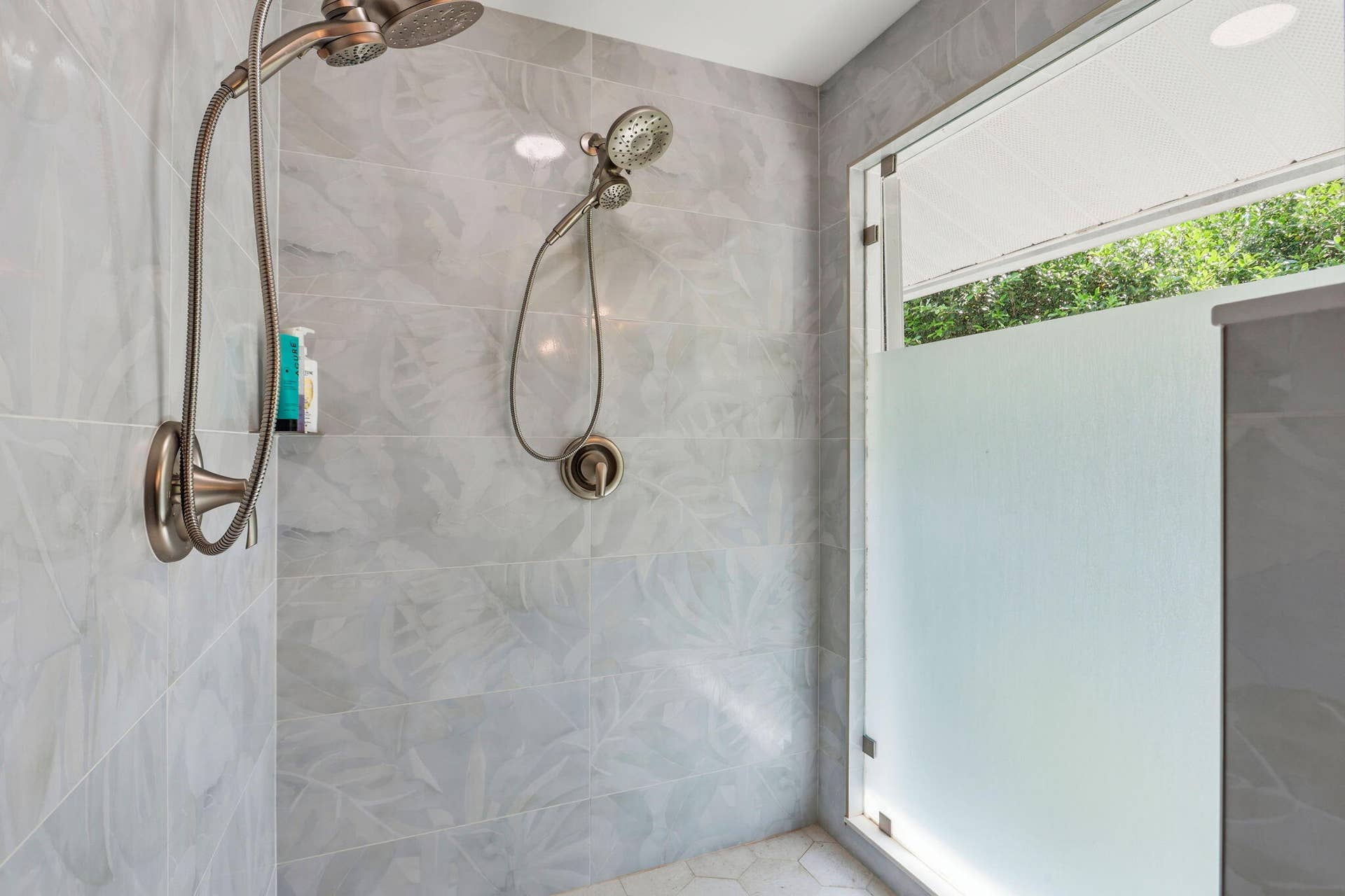 Walk-in shower with large frosted glass