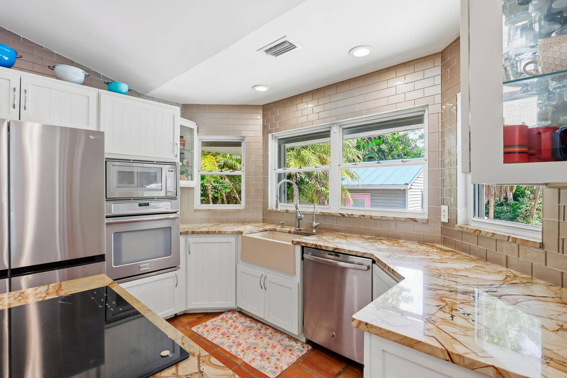 Quartzite counters and bay windows that overlook the pool