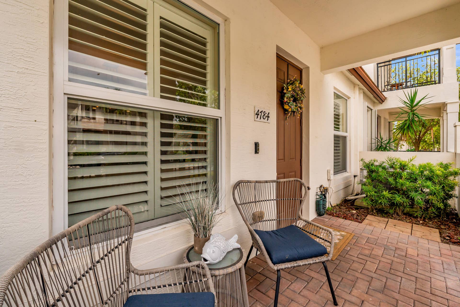 4784 Acadian Trail, Coconut Creek, FL 33073 Front Porch. This home has impact windows for peace of mind.