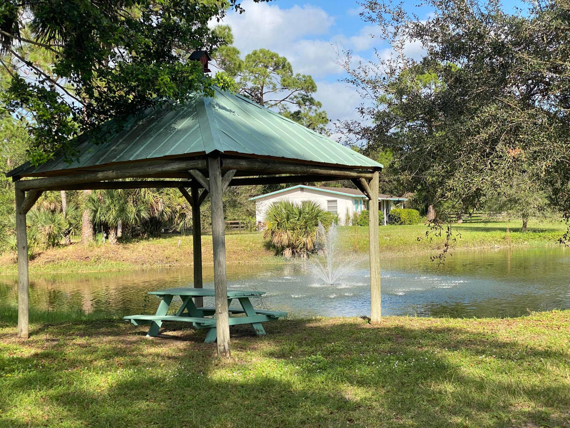 Pond with Fountain looking toward Cottage through Gazebo