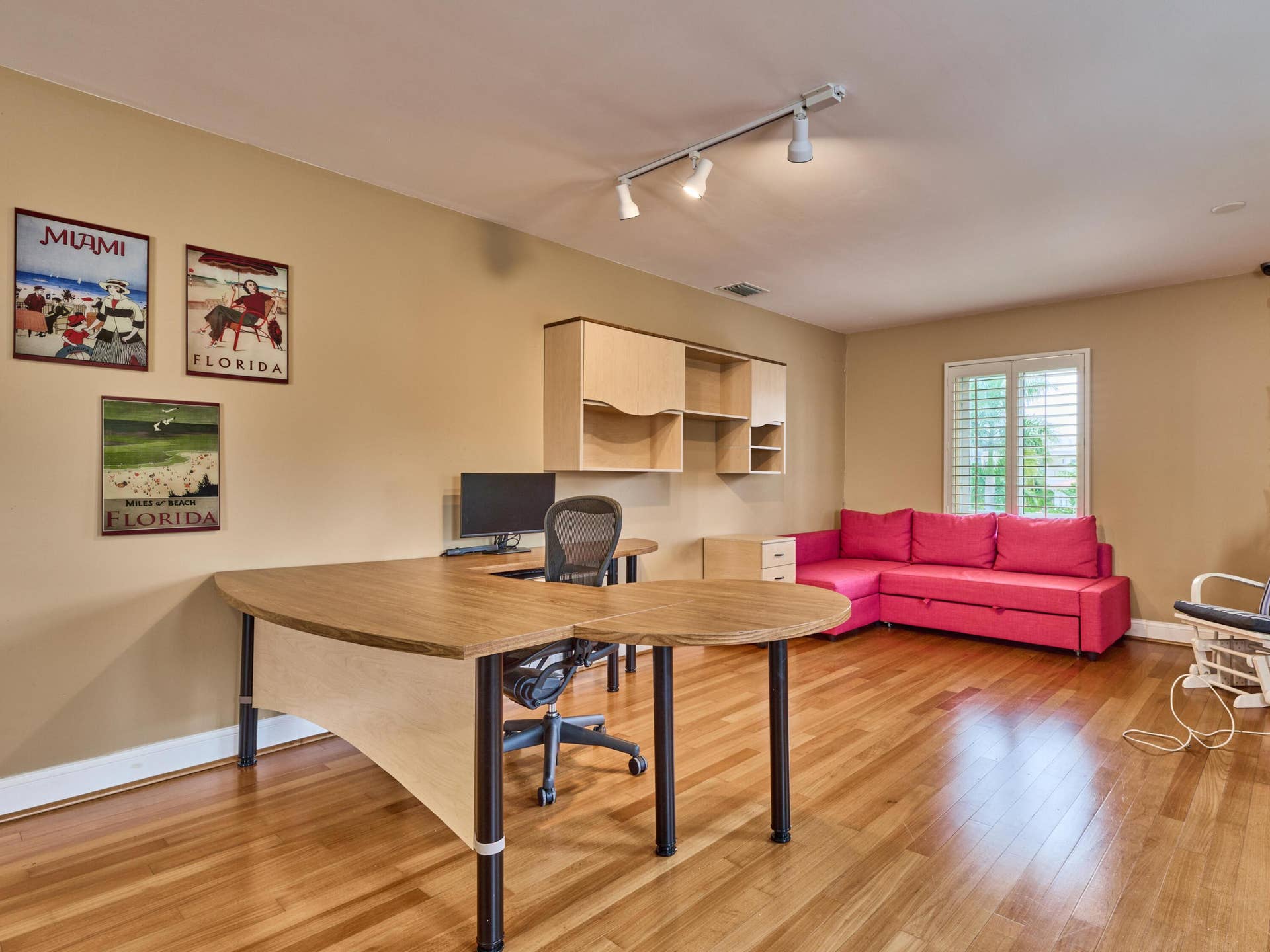 Desk, sitting area of guest apartment.