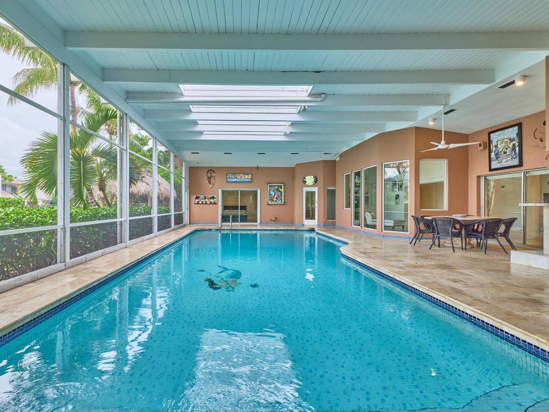 Giant Enclosed pool. One side is screened.