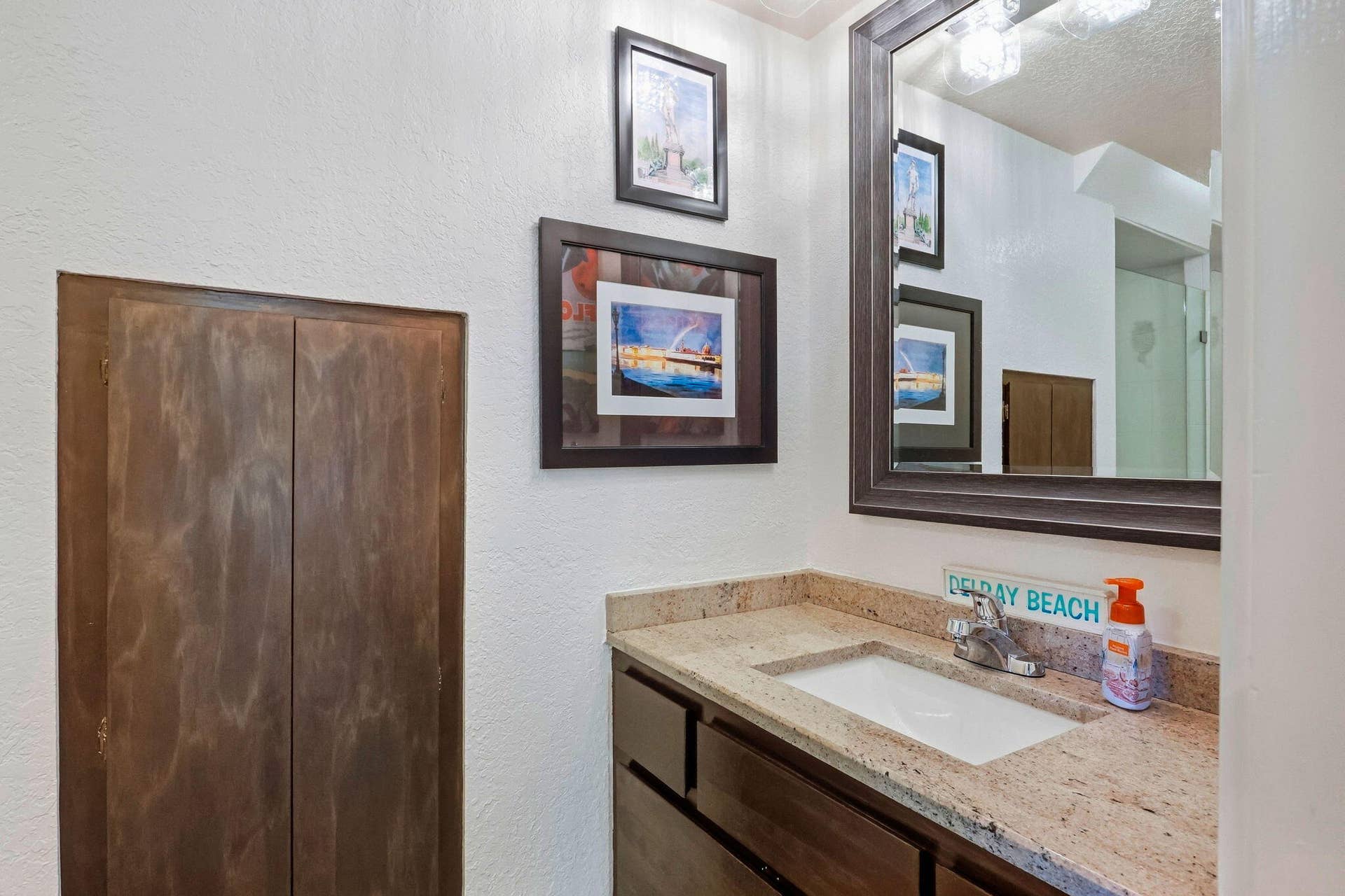 900 Greensward Lane, #209-G, Delray Beach, FL 33445 Vanity with a neutral-toned countertop and an integrated sink