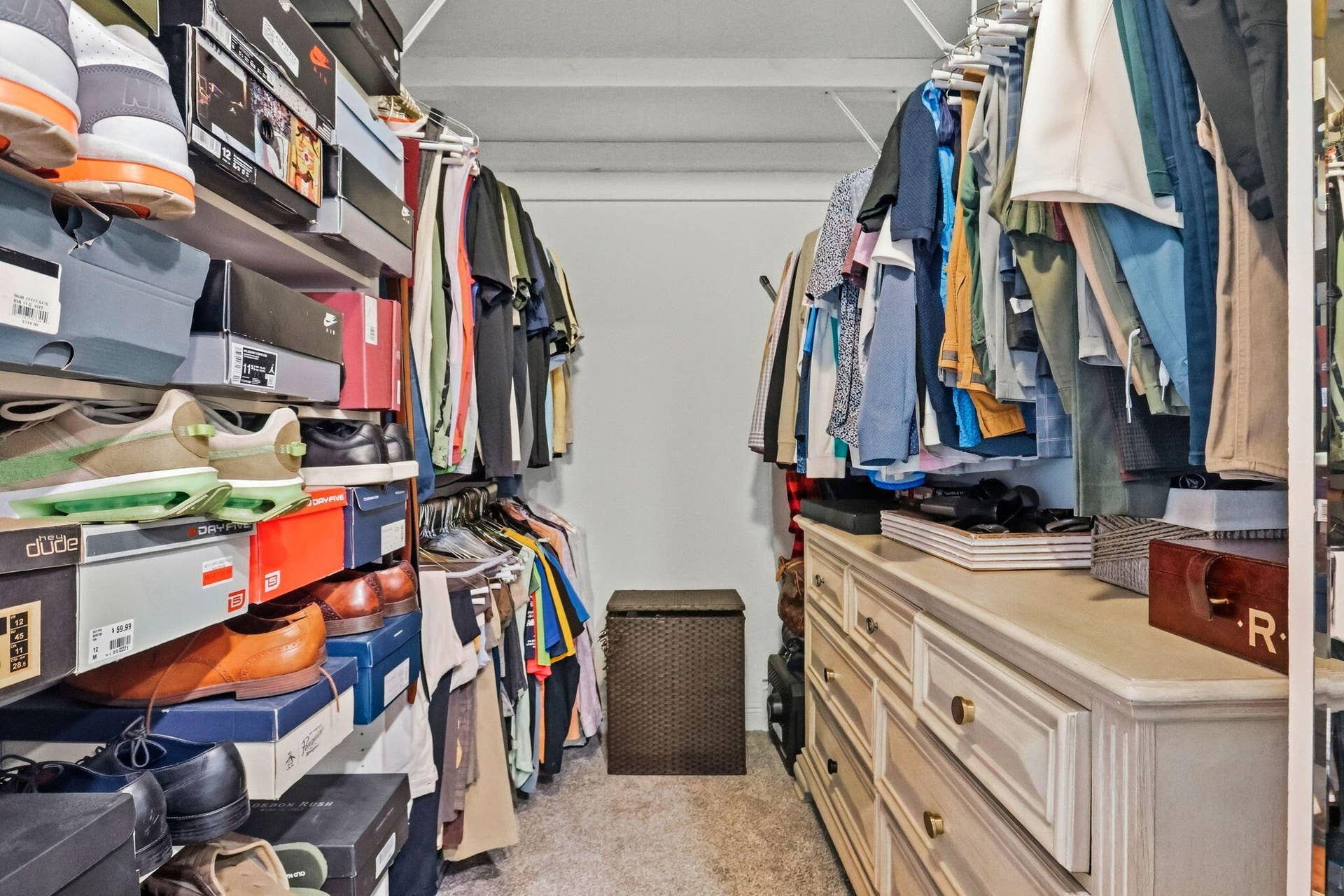 900 Greensward Lane, #209-G, Delray Beach, FL 33445 Walk-in closet featuring built-in shelving, clothing racks, and a dresser with drawers