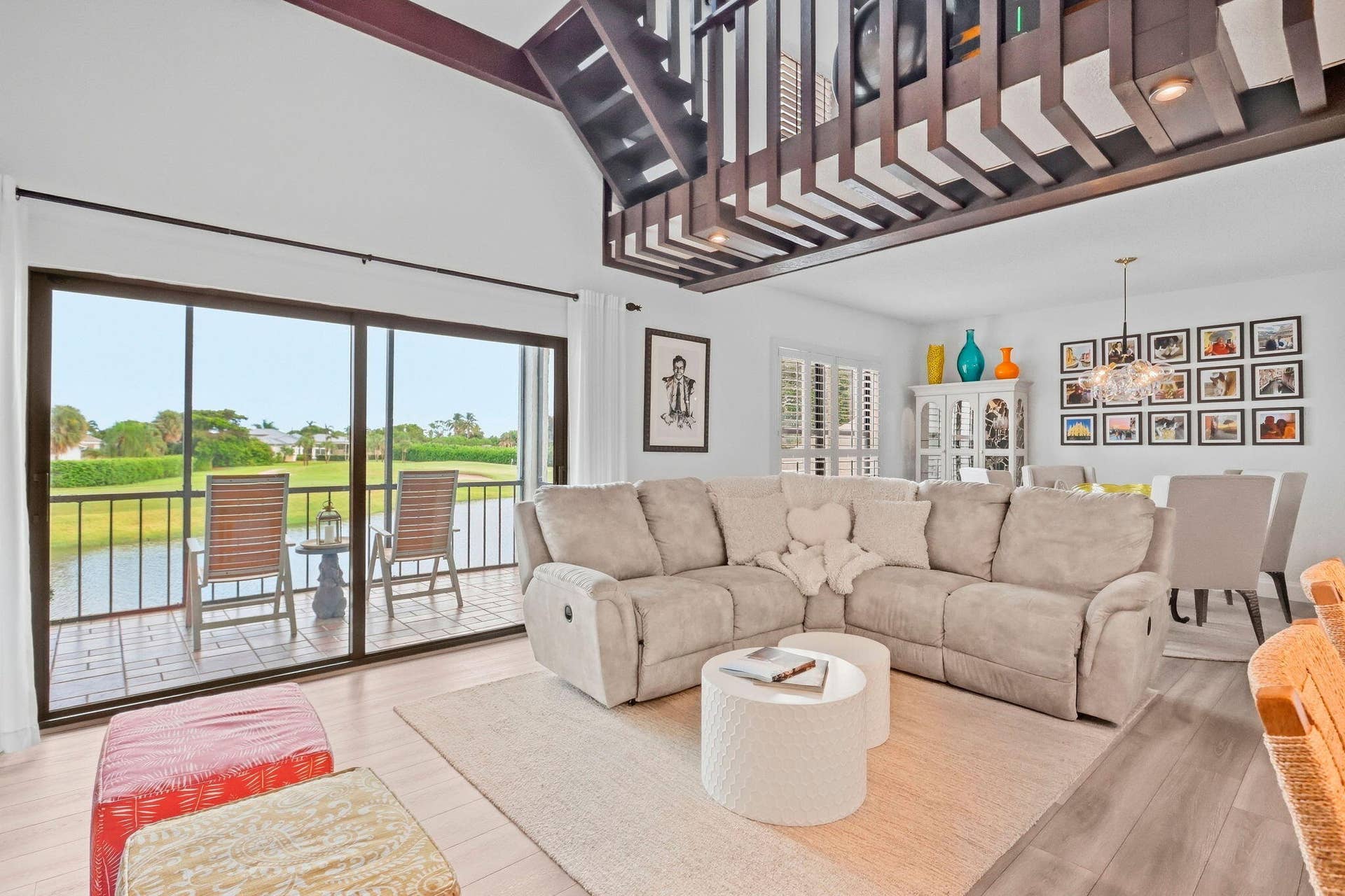 900 Greensward Lane, #209-G, Delray Beach, FL 33445 Vaulted ceilings with exposed beams, wood-finish flooring, and a screened patio with water frontage