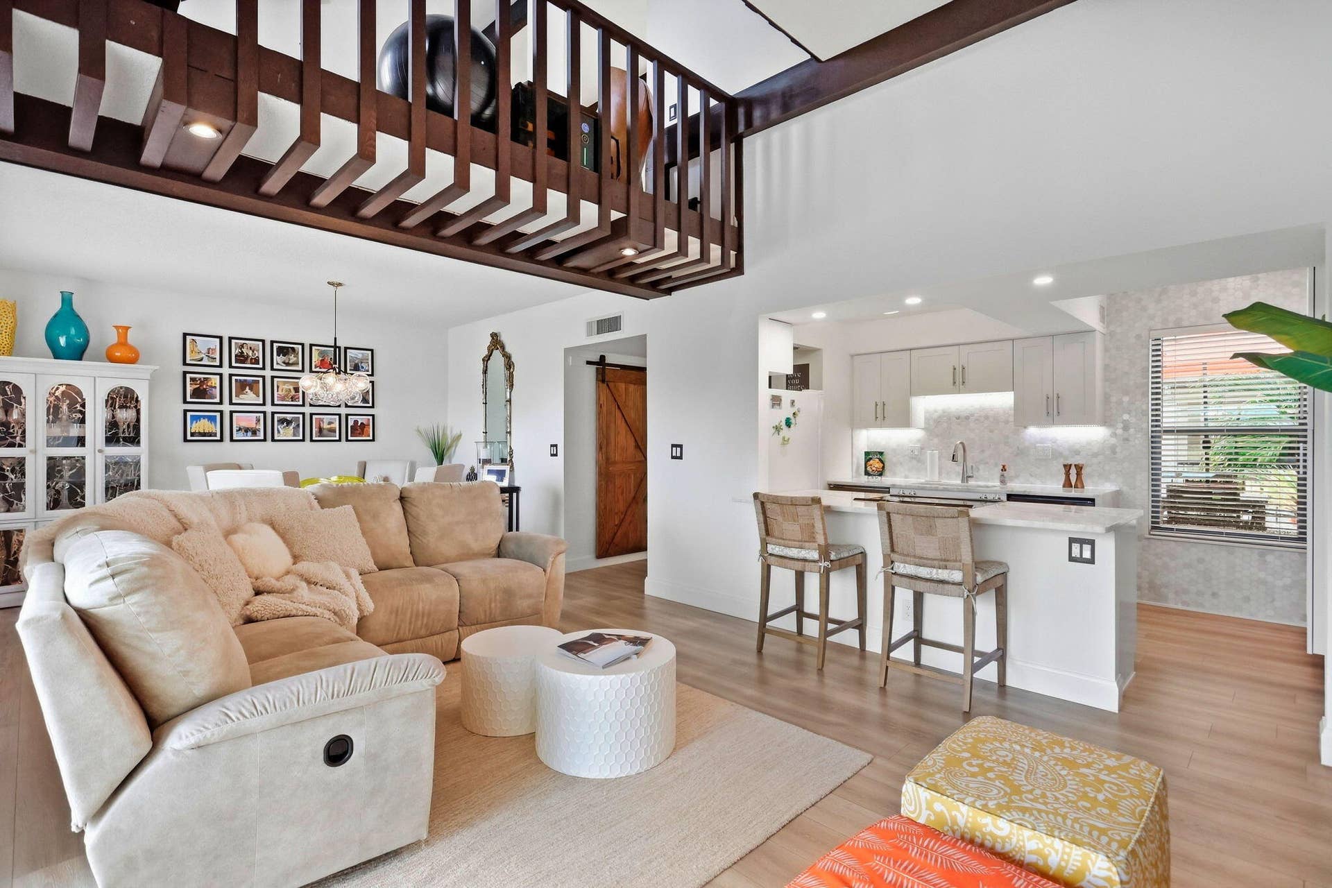 900 Greensward Lane, #209-G, Delray Beach, FL 33445 Open-concept living space with wood-finish flooring