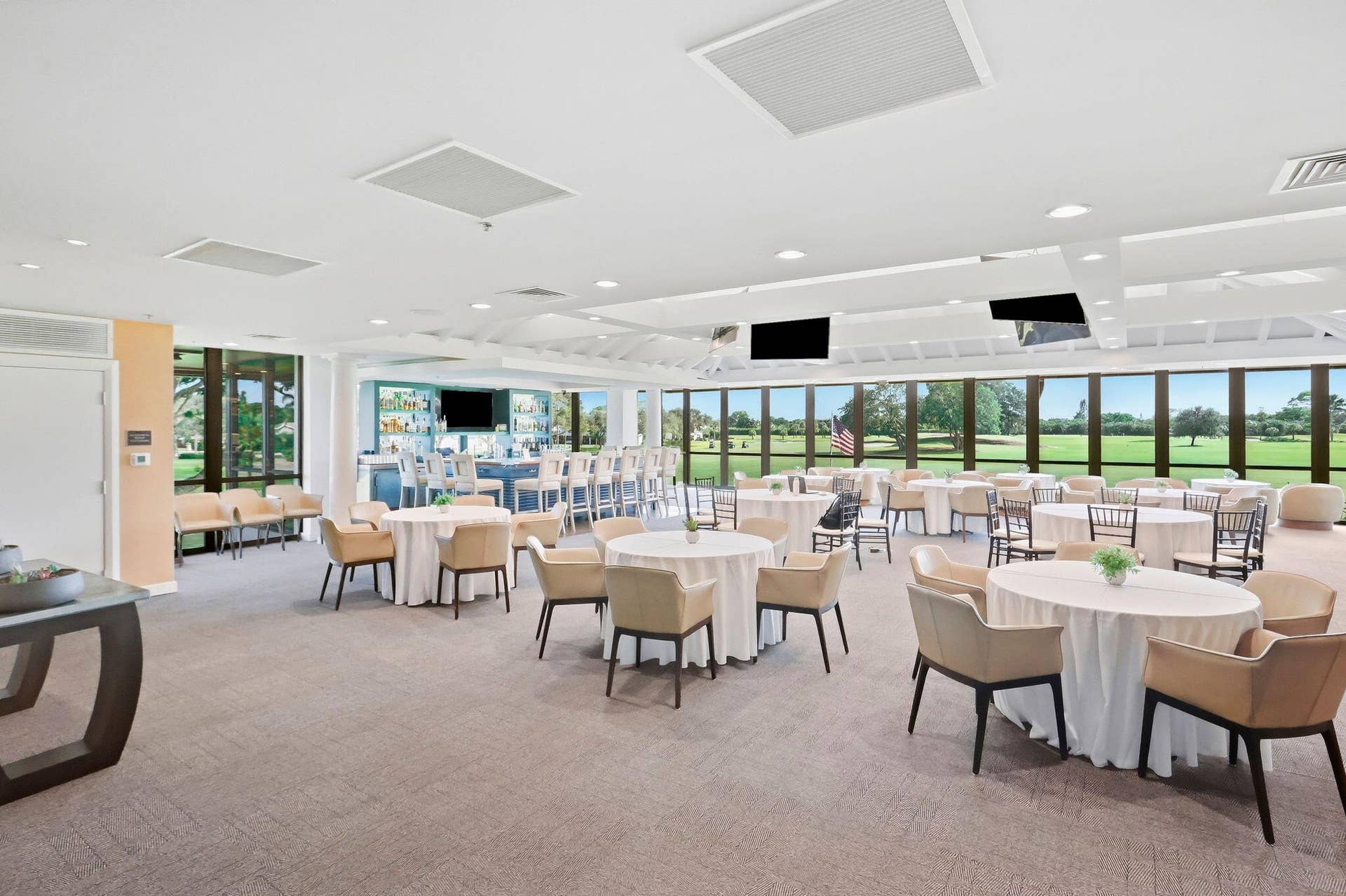 900 Greensward Lane, #209-G, Delray Beach, FL 33445 Open-concept common room with a built-in bar, extensive window line, and recessed lighting