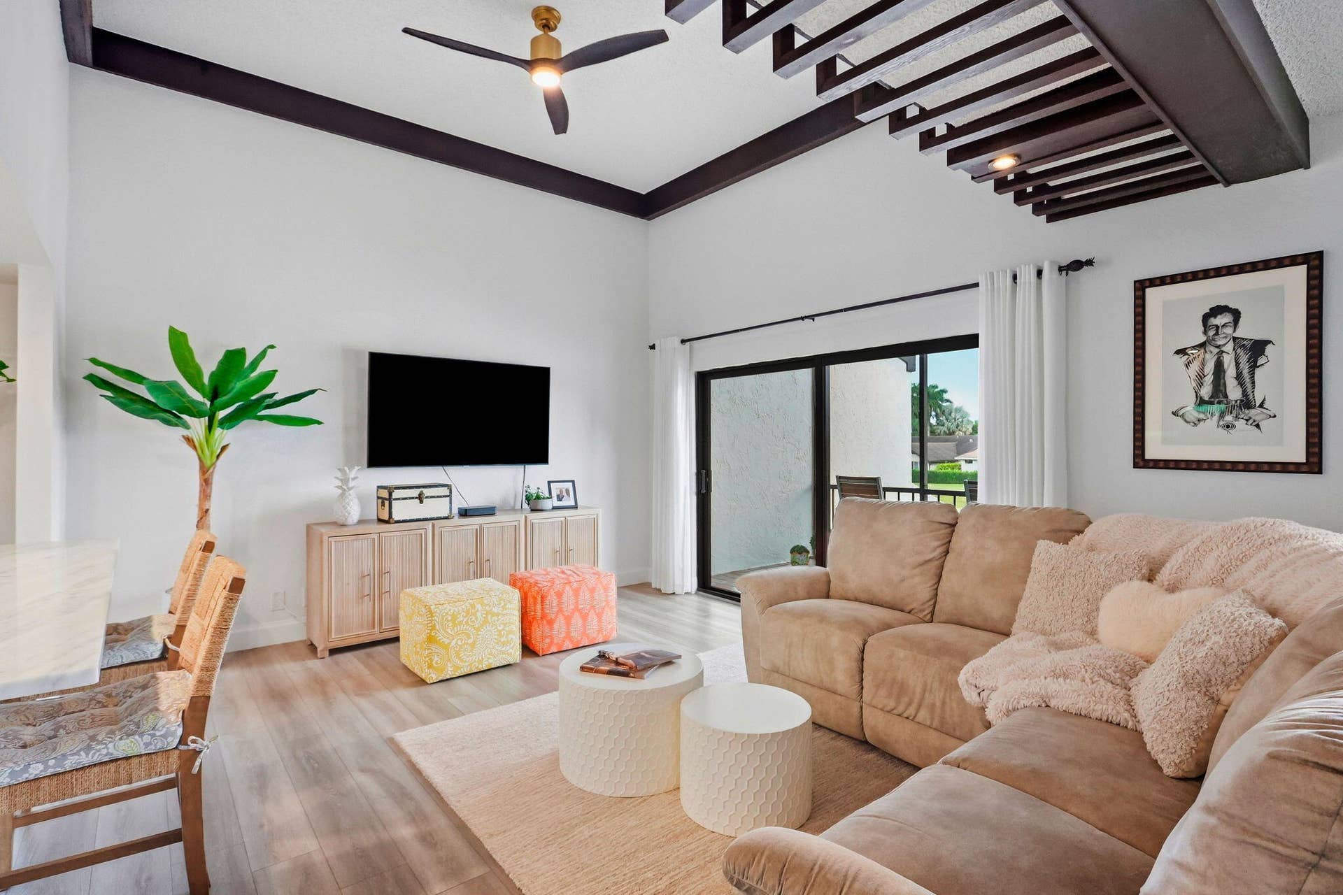 900 Greensward Lane, #209-G, Delray Beach, FL 33445 Vaulted ceiling with exposed beams, wood-finish flooring, and sliding glass doors