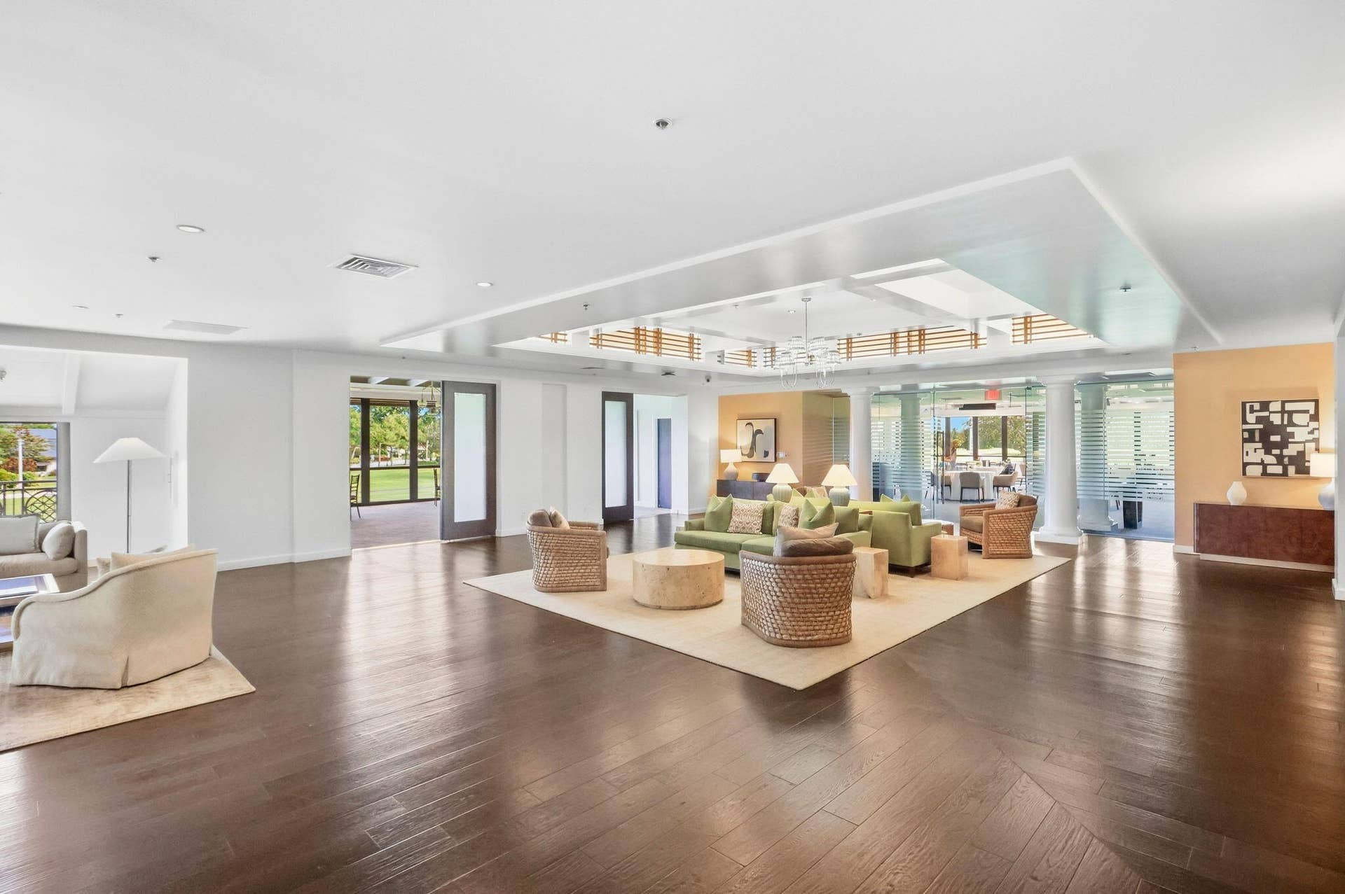 900 Greensward Lane, #209-G, Delray Beach, FL 33445 Spacious interior with dark wood-finish flooring, recessed lighting, and a tray ceiling