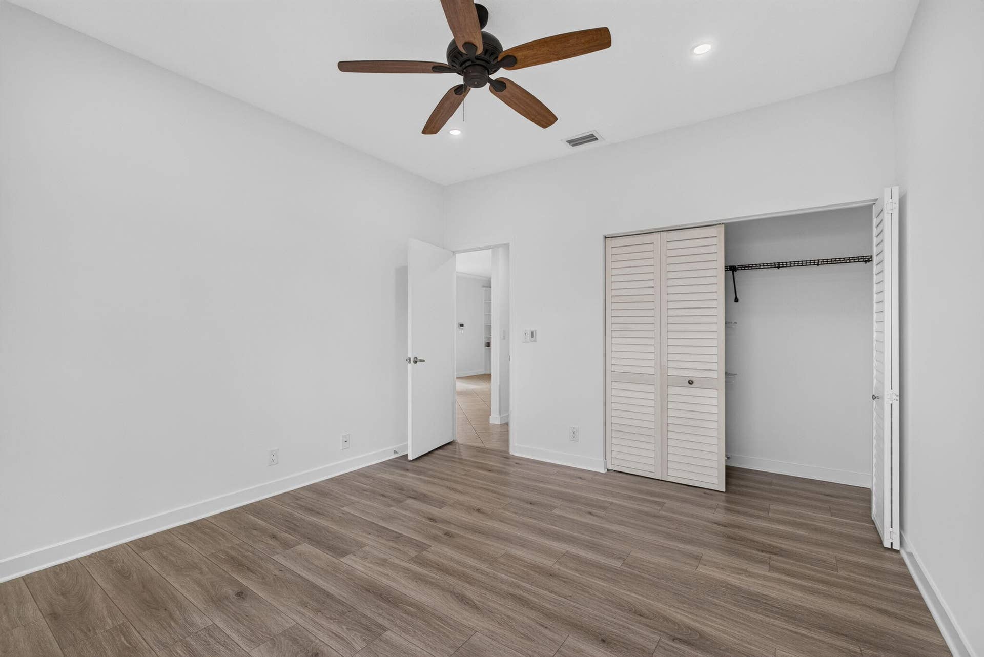 16 - Bedroom with wood-look flooring