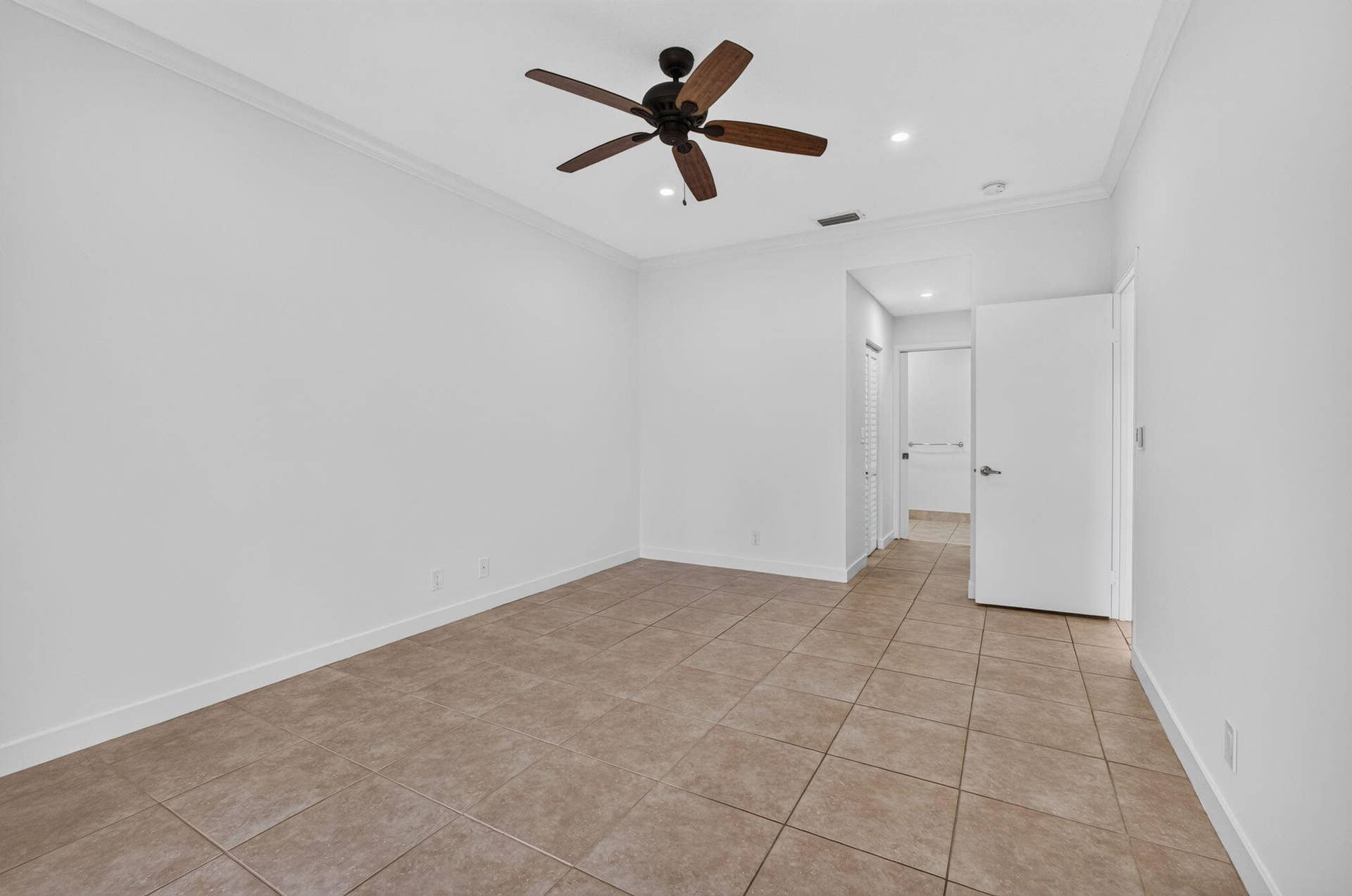 11 - Bedroom with tile flooring