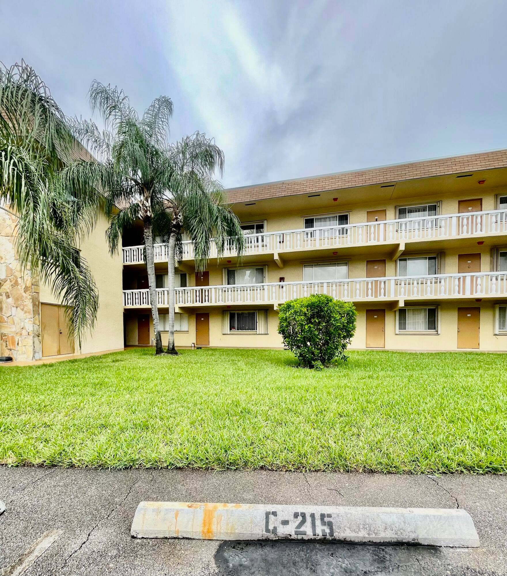 600 VILLAGE GREEN Court, #215, Palm Springs, Palm Springs, FL 33461 Assigned parking in front of unit
