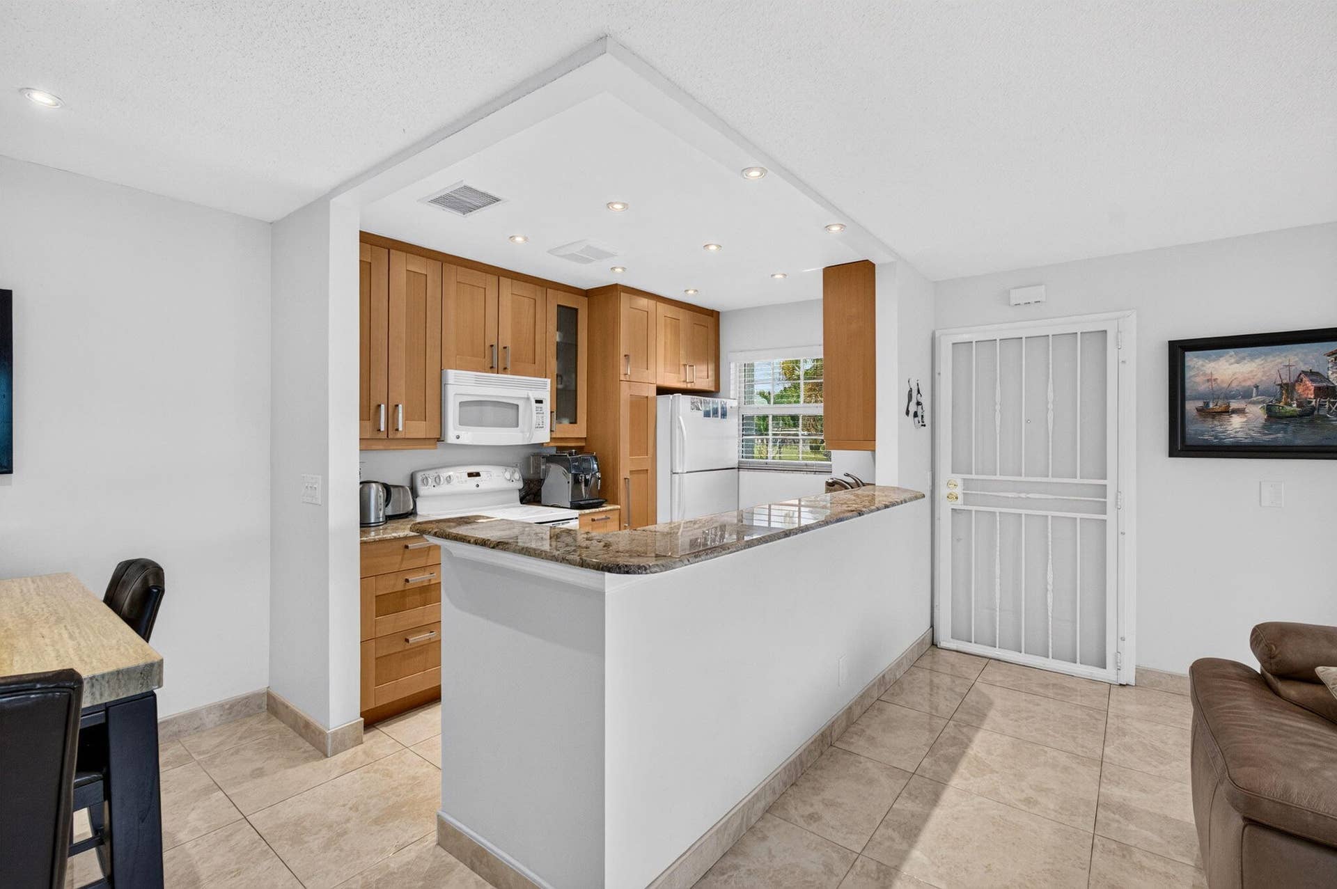 Open concept kitchen with granite counte