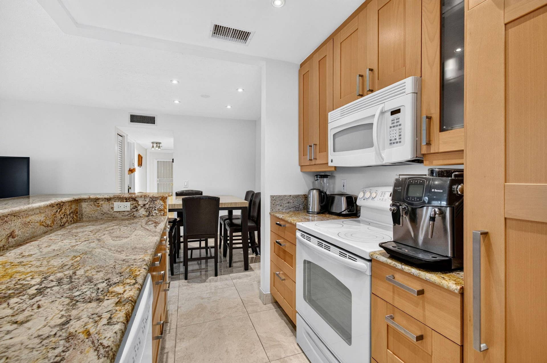 Open concept kitchen with granite counte