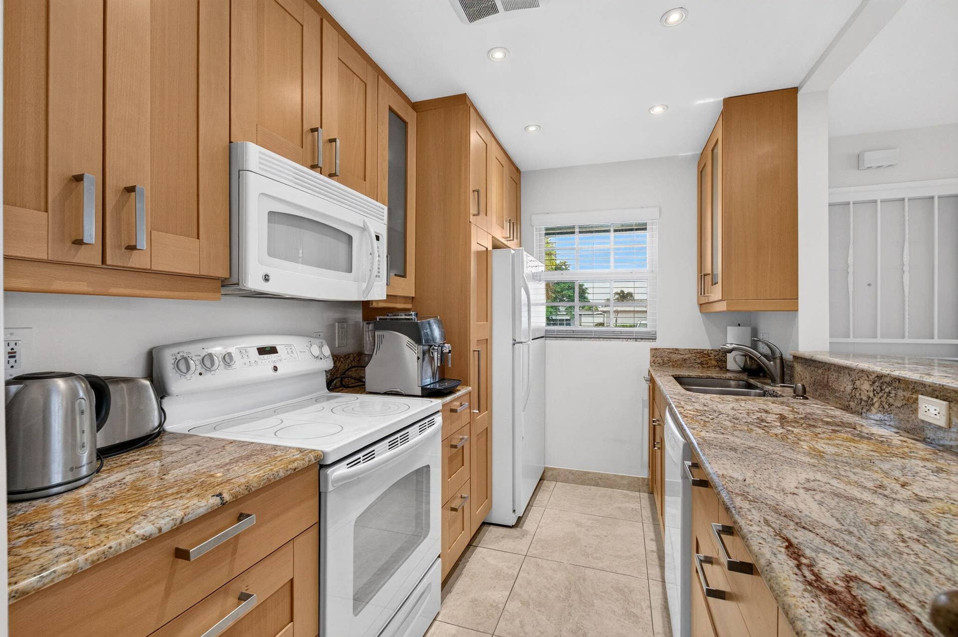 Open concept kitchen with granite counte