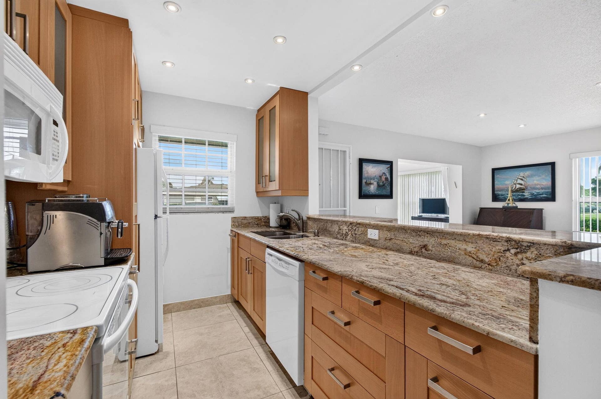 Open concept kitchen with granite counte