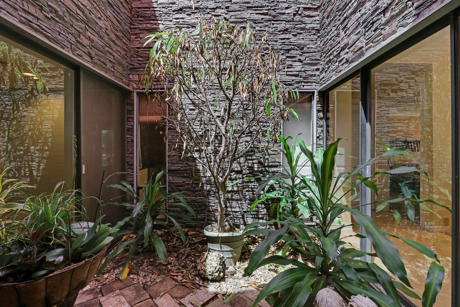 6514 Timber Lane, Boca Raton, FL 33433 Interior atrium brings natural light into the heart of the home