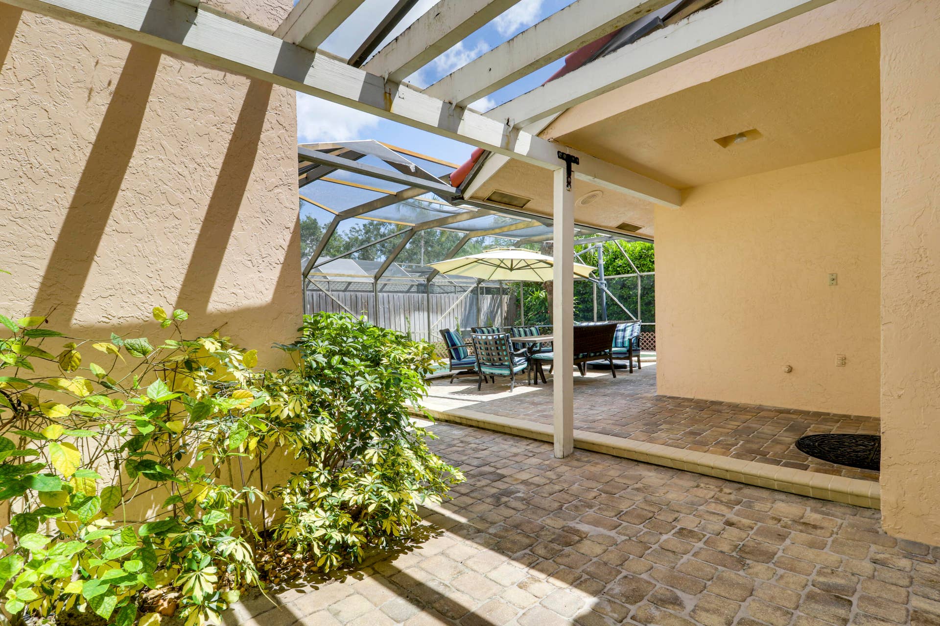 6514 Timber Lane, Boca Raton, FL 33433 Pergola-covered outdoor retreat with space for lounging, dining or a future hot tub