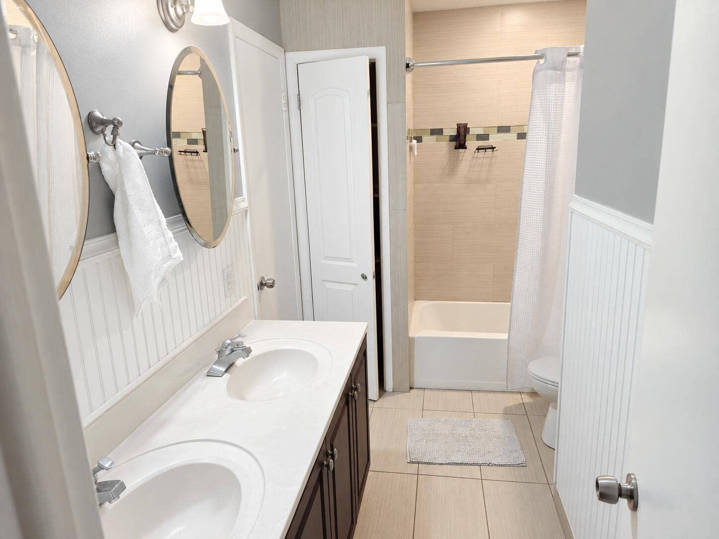 Dual vanity with white undermount sinks and chrome fixtures
