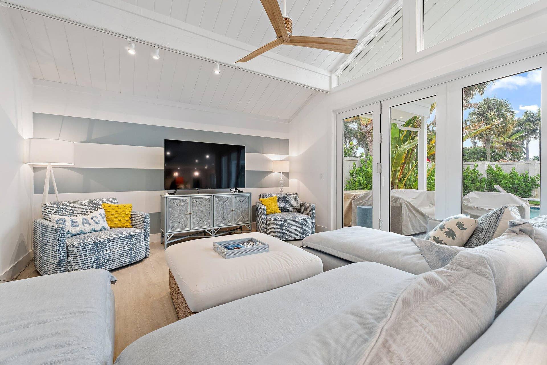 volume ceilings + oversized windows... bright + airy!