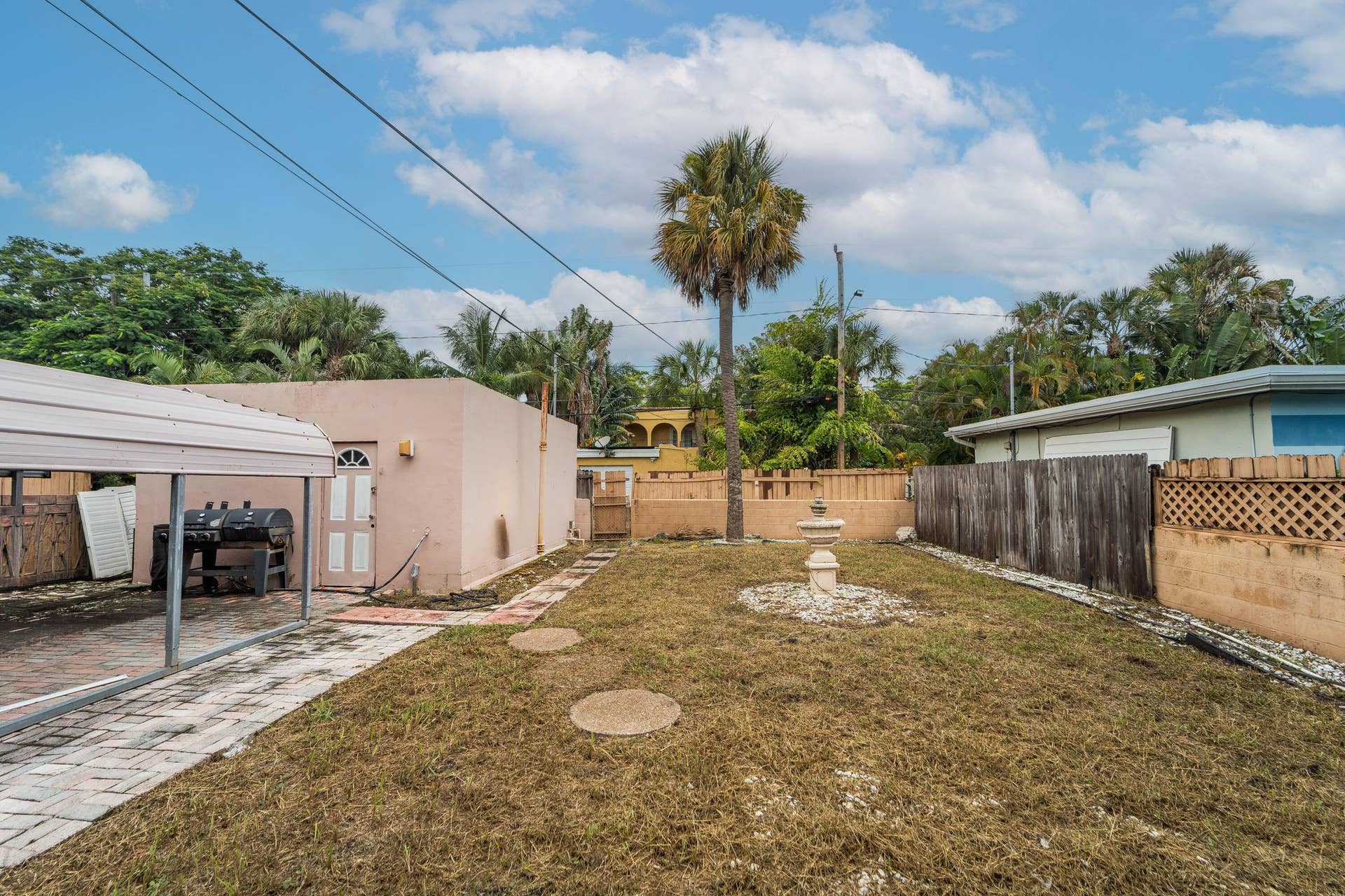521 26TH Street, West Palm Beach, FL 33407 View of the backyard. Has sufficient room for a in-ground pool. Front view of garage.