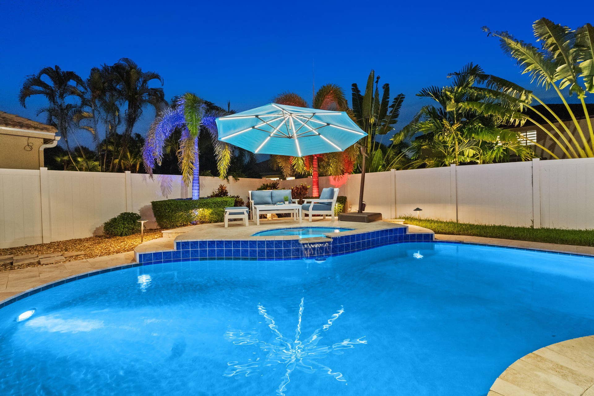 Fully fenced backyard retreat with heated pool/spa, summer kitchen and more.