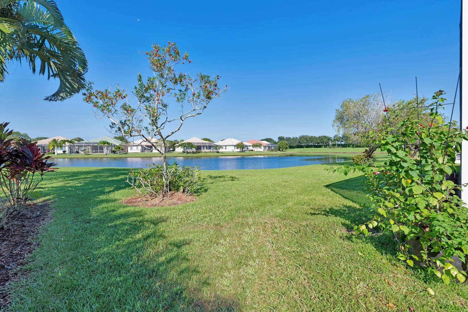 9542 Lantern Bay Circle, West Palm Beach, FL 33411 Side w Lake