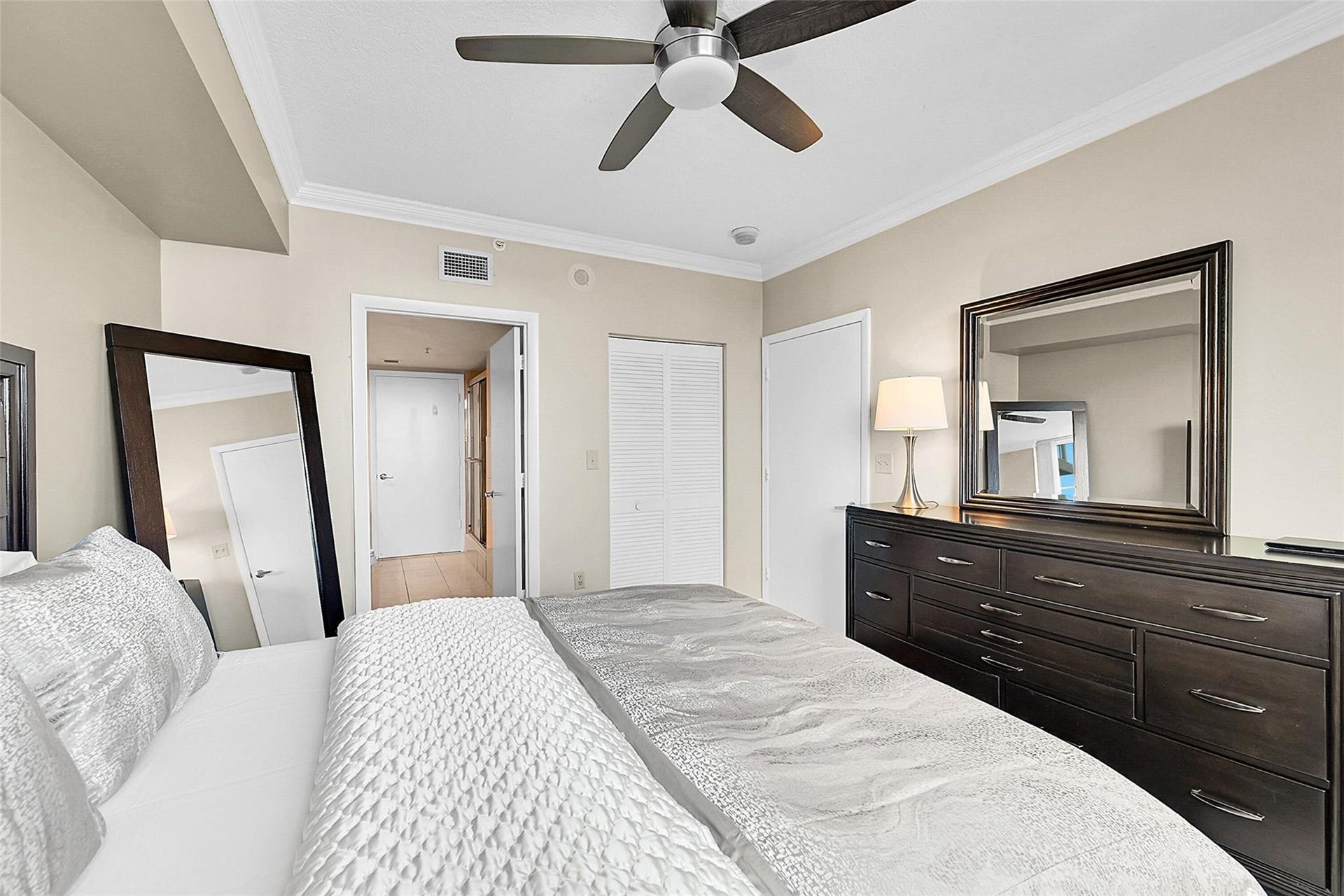 3020 NE 32ND Avenue, #805, Fort Lauderdale, FL 33308 Wake up to breathtaking ocean views from this spacious bedroom designed for comfort and relaxation.