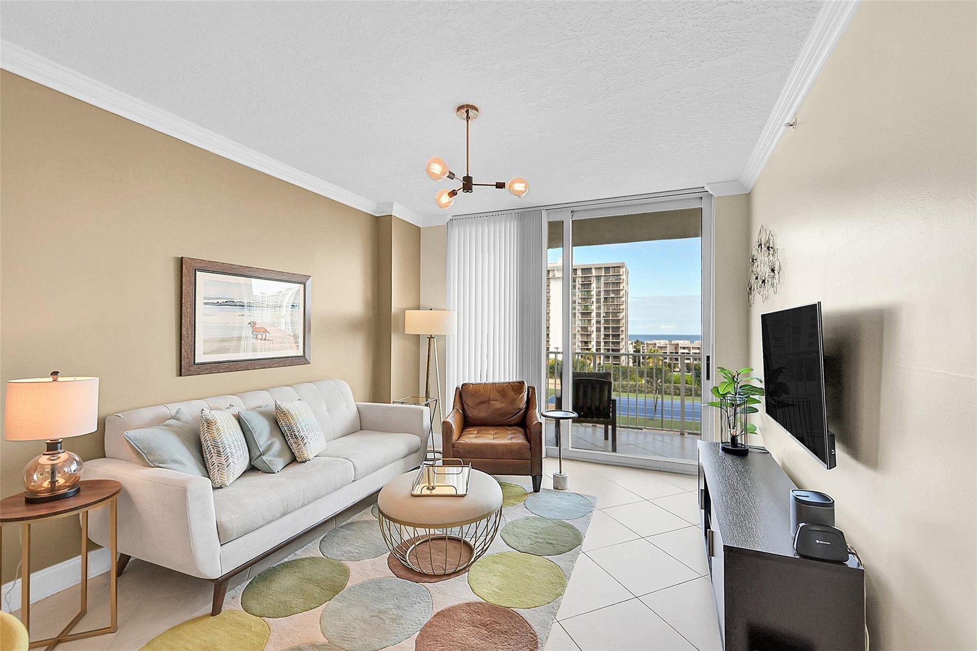 3020 NE 32ND Avenue, #805, Fort Lauderdale, FL 33308 Natural light fills the living room, where impact sliding glass doors open to your private balcony and breathtaking ocean views.