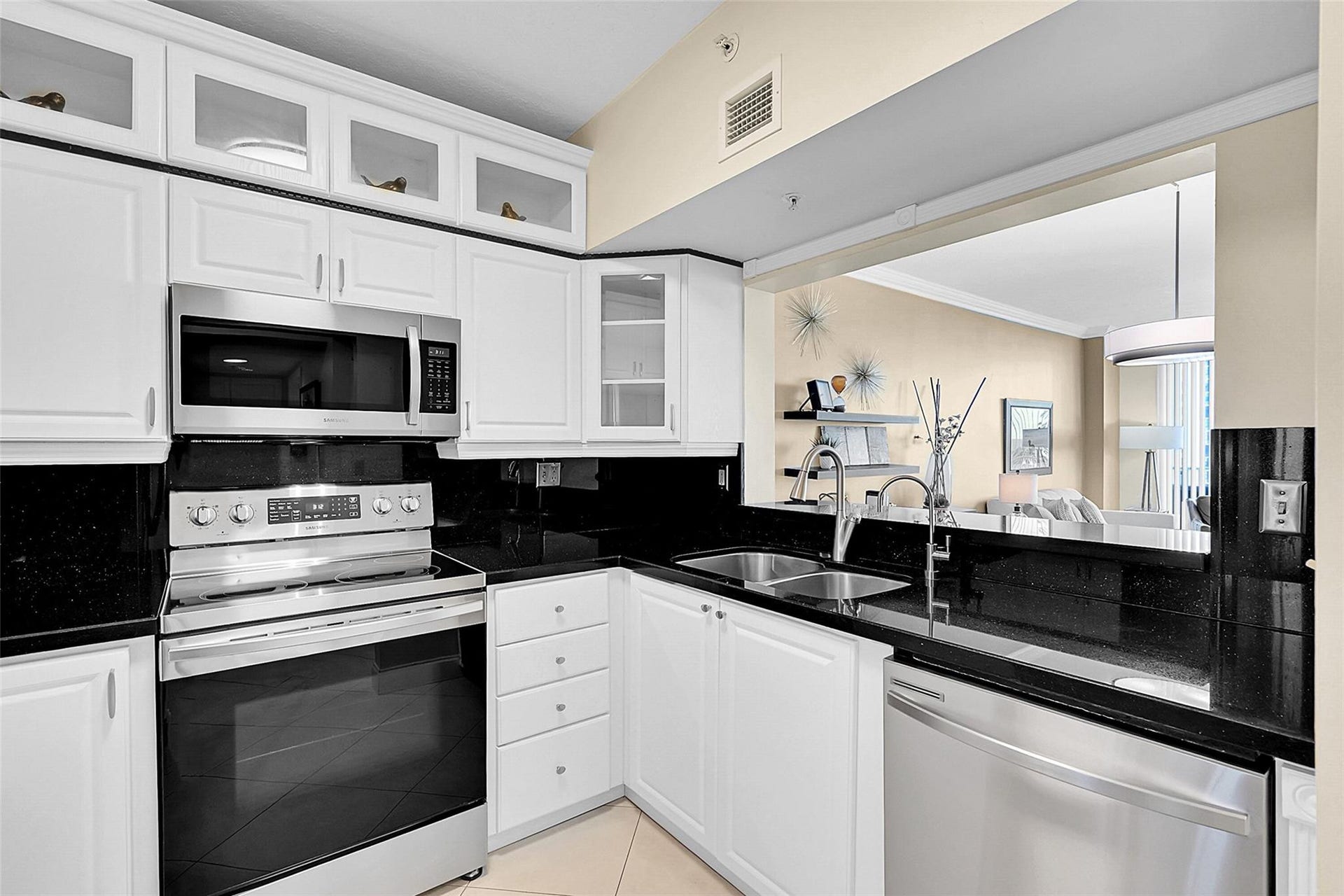 3020 NE 32ND Avenue, #805, Fort Lauderdale, FL 33308 The pass through design creates a seamless connection between the kitchen and dining area, making everyday living and entertaining effortless.