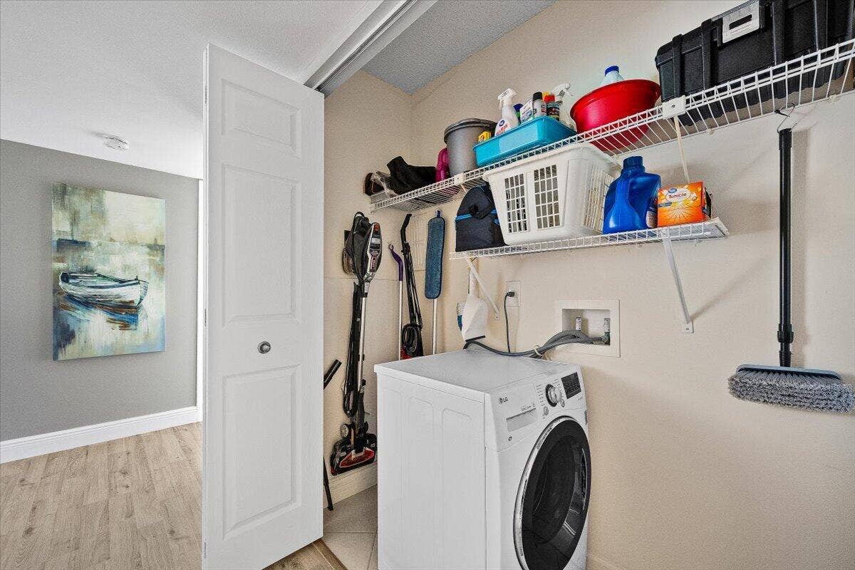630 Ocean Drive, #407, Juno Beach, FL 33408 Closet with Washer/Dryer Combo