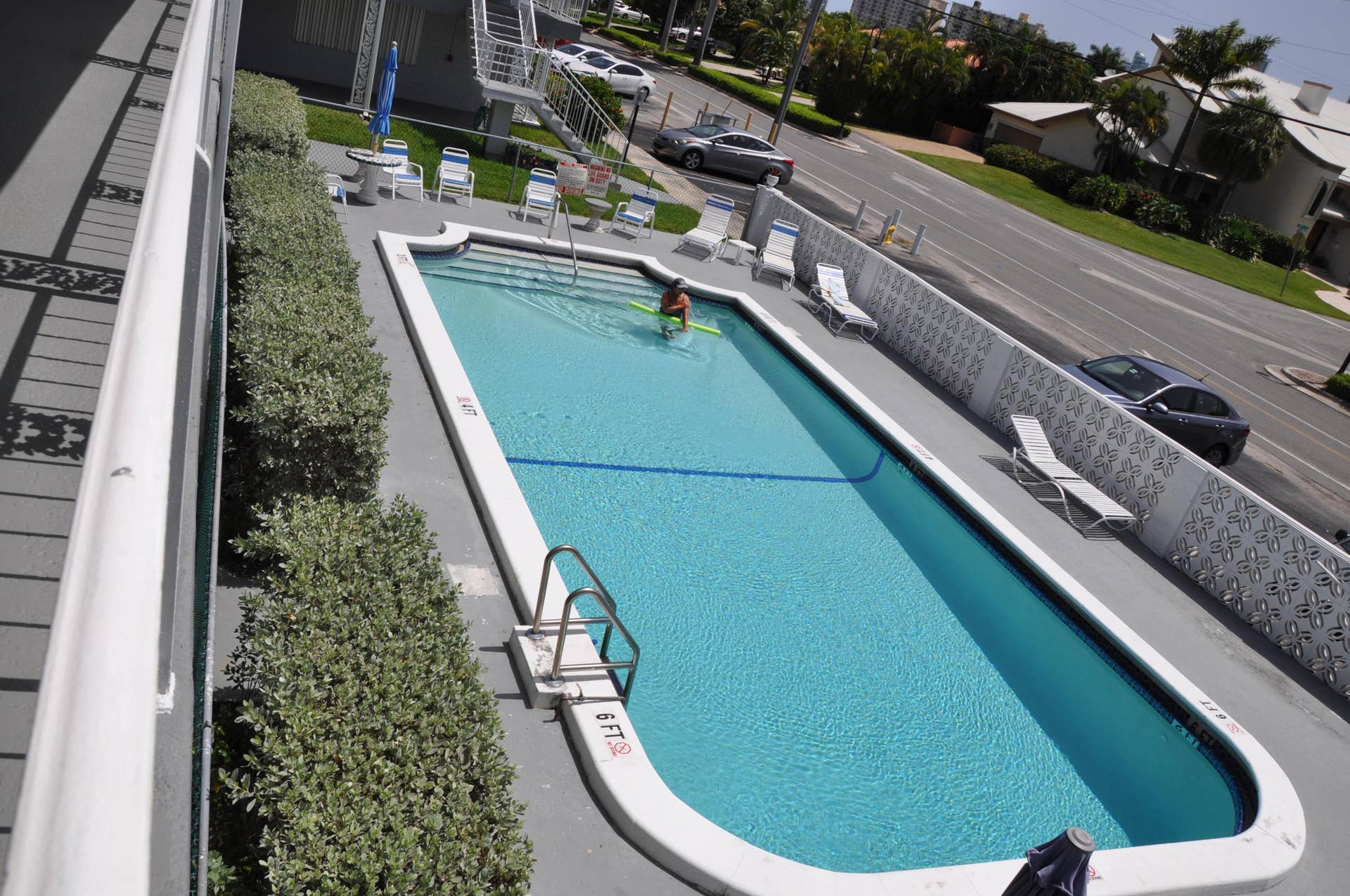 630 Layne Boulevard, #208, Hallandale Beach, Hallandale Beach, FL 33009 Rectangular swimming pool with integrated steps, surrounded by a light-toned deck