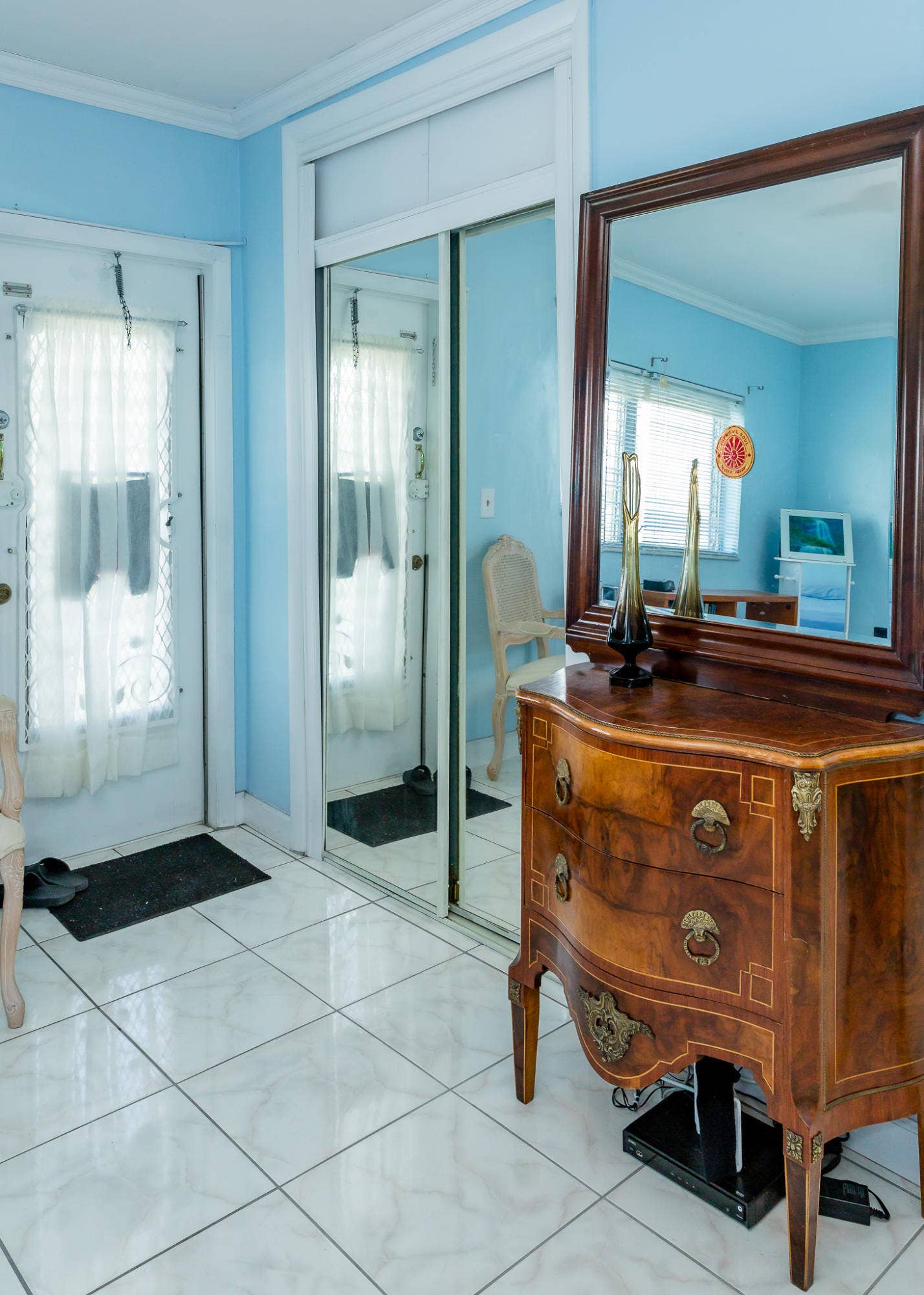 630 Layne Boulevard, #208, Hallandale Beach, Hallandale Beach, FL 33009 White tile flooring, mirrored closet doors, and crown molding
