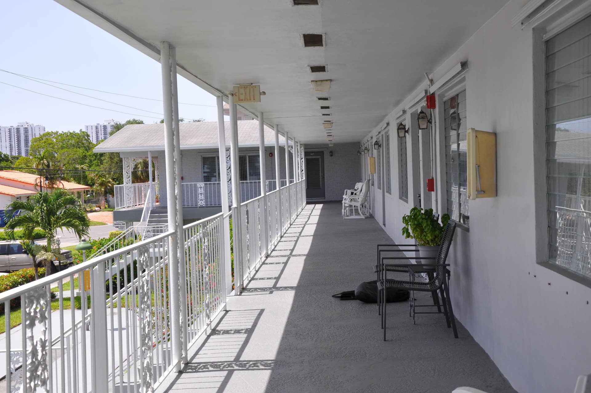 630 Layne Boulevard, #208, Hallandale Beach, Hallandale Beach, FL 33009 Covered exterior walkway with white metal railing and support columns