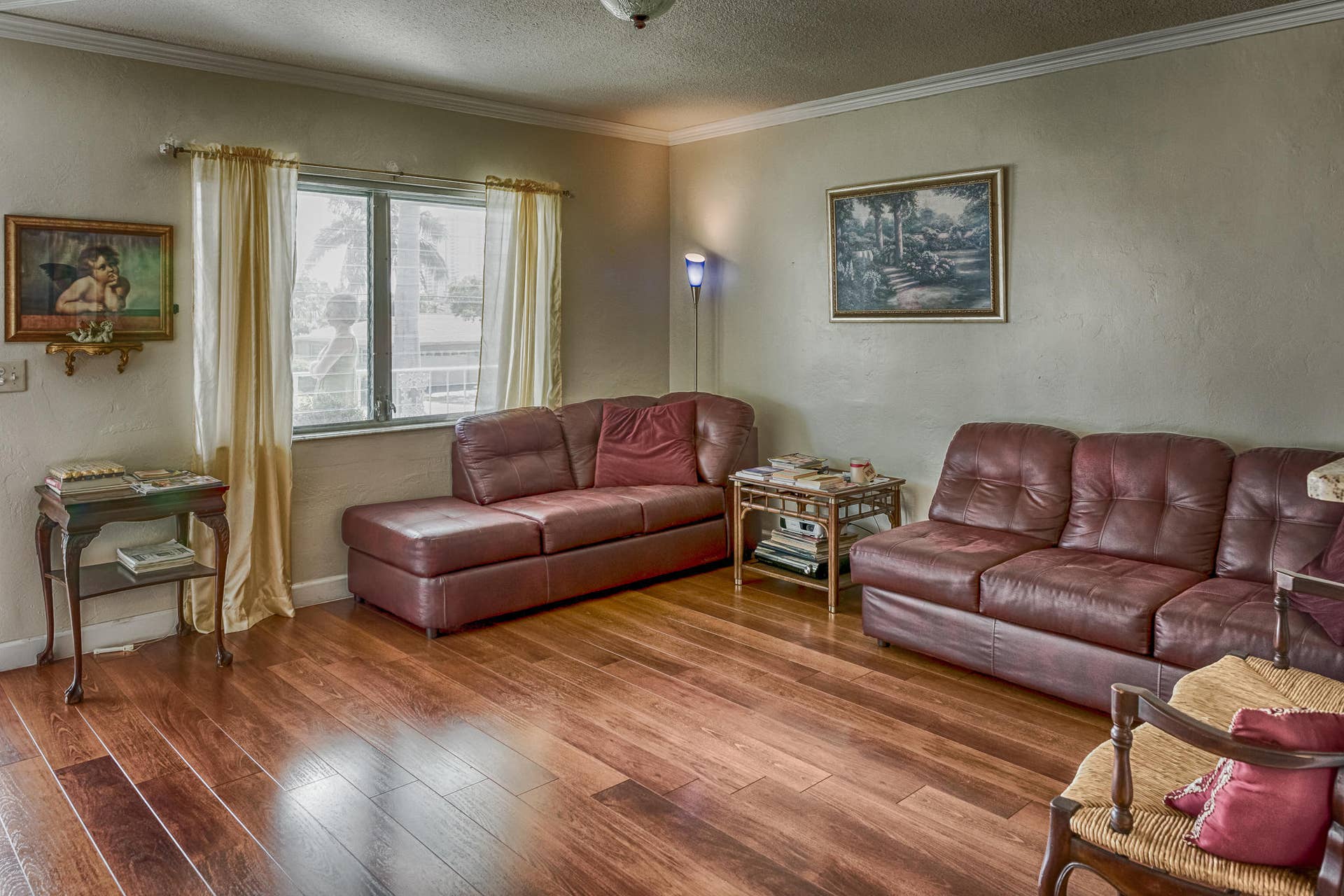 630 Layne Boulevard, #208, Hallandale Beach, Hallandale Beach, FL 33009 Wood-finish flooring, crown molding, and a window with natural light