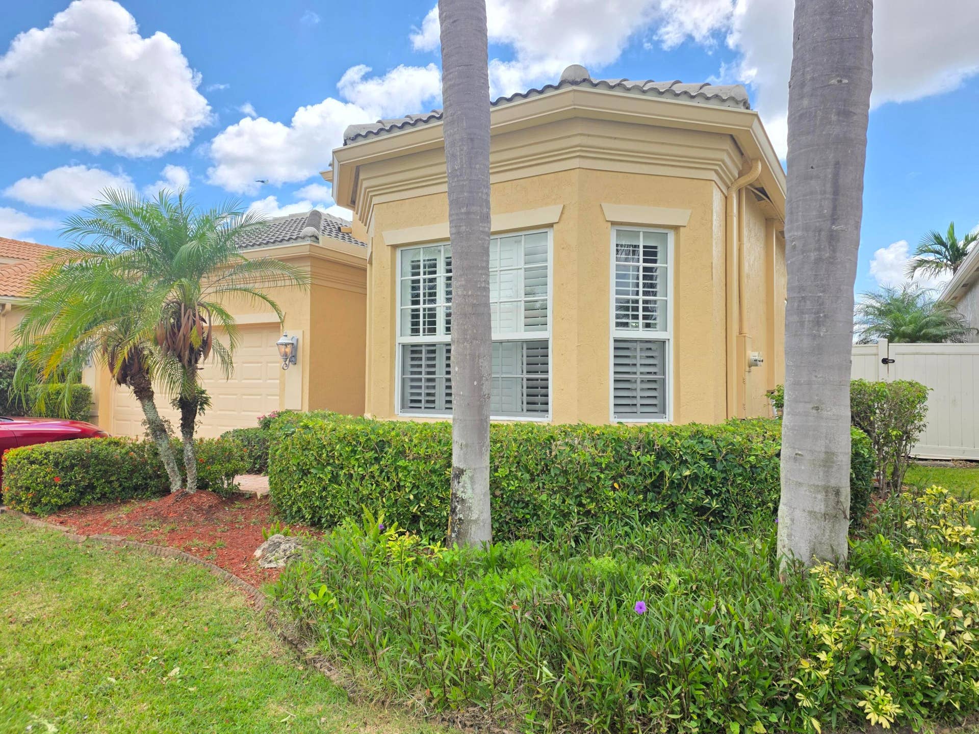 LUSH LANDSCAPING BAY WINDOW