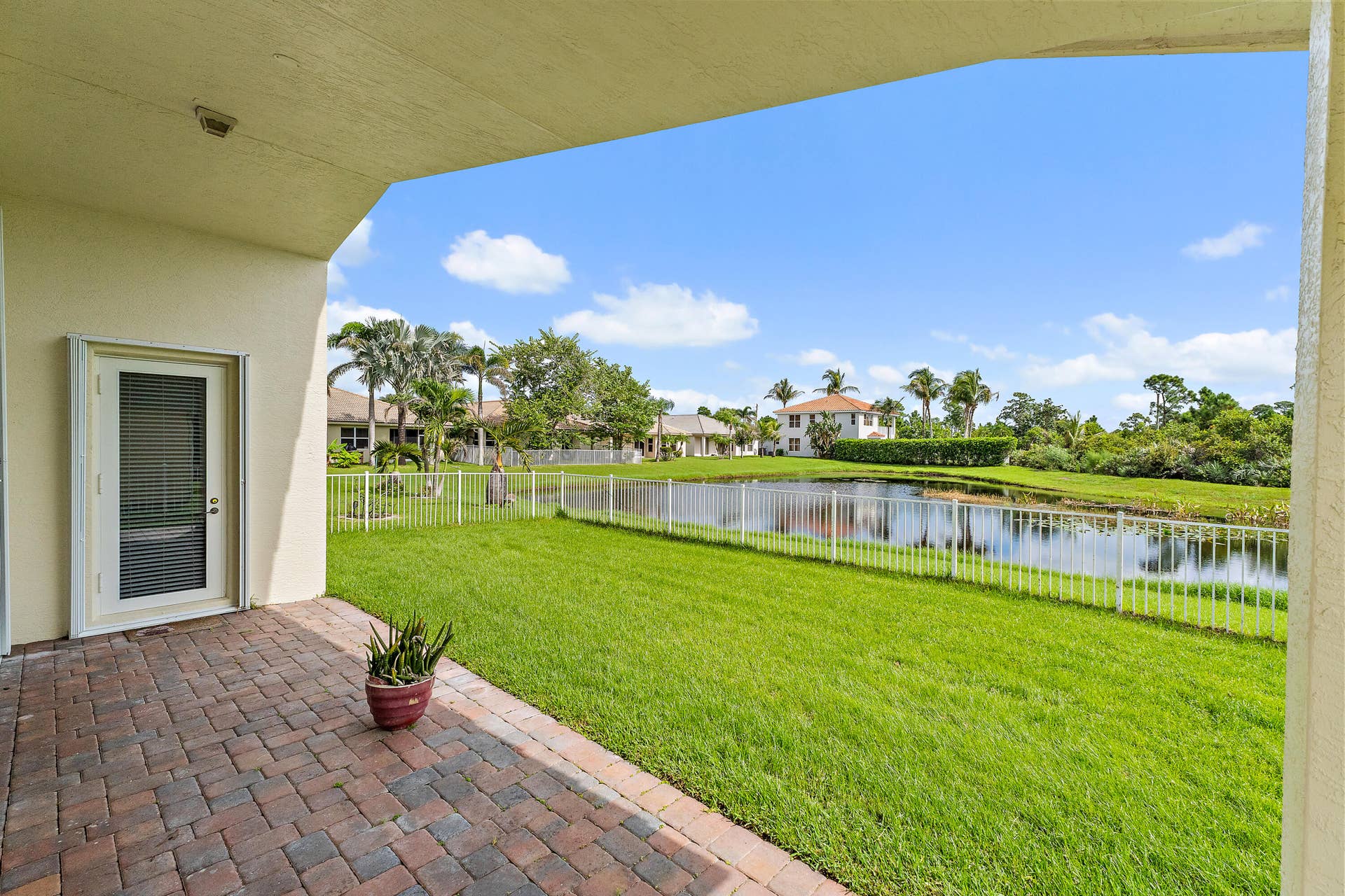5183 SE Graham Drive, Stuart, FL 34997 From Living room or the primary Bedroom access the back patio. Its very beautiful back there.