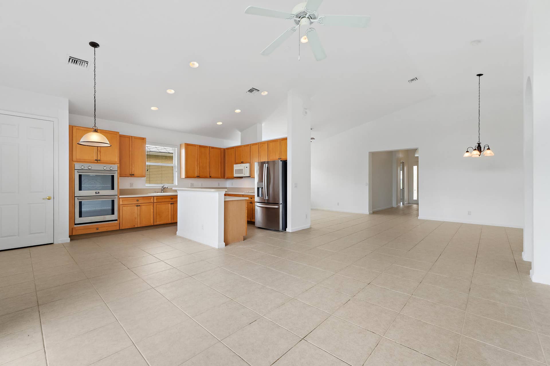 5183 SE Graham Drive, Stuart, FL 34997 The kitchen is open to the family room, so whoevers cooking is still part of the conversation.
From the kitchen you can see straight through the great room to the pond and preserve.