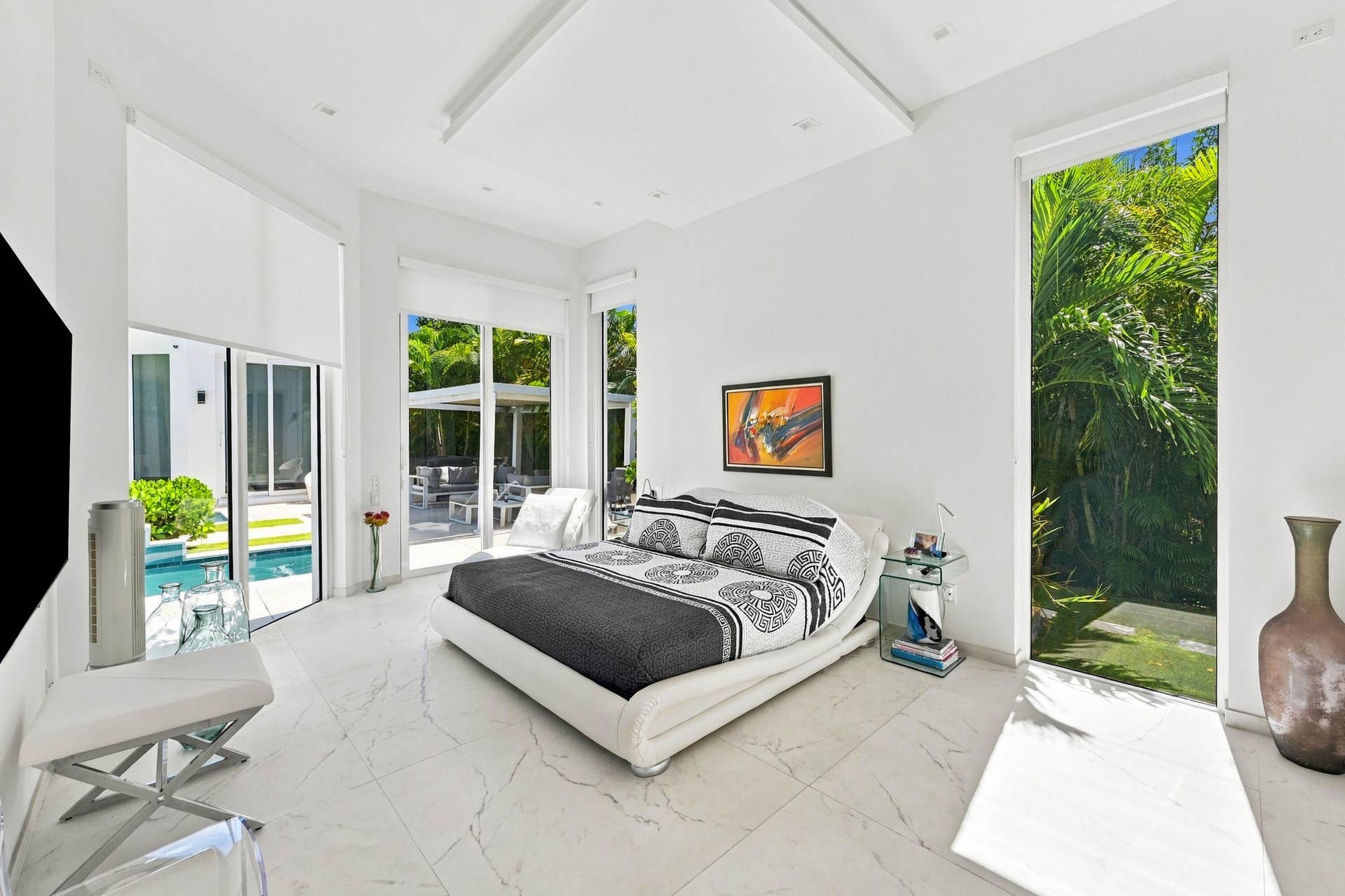 110 NE 16TH Place, Fort Lauderdale, FL 33305 White marble-look flooring, recessed lighting, and a tray ceiling