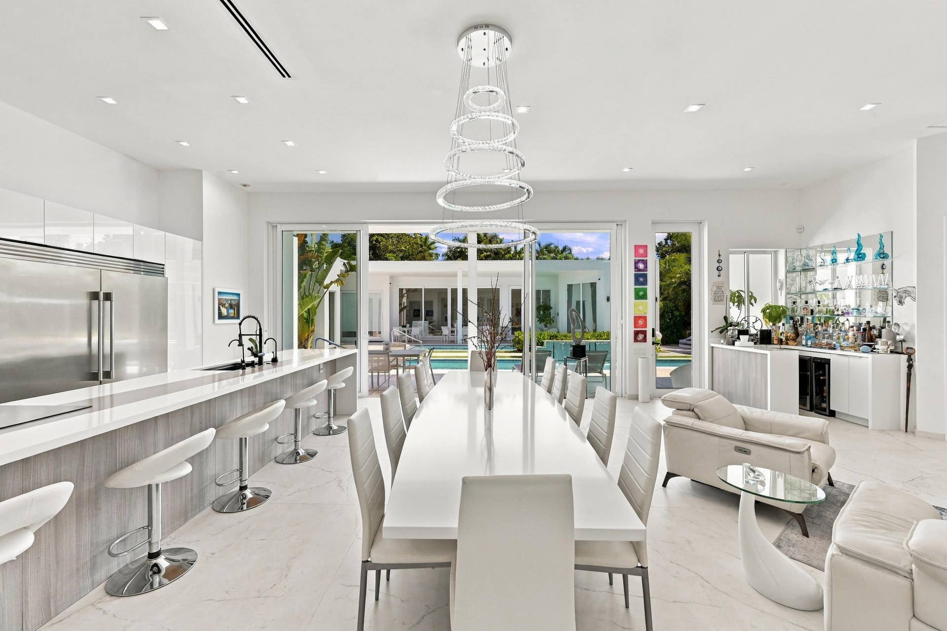 110 NE 16TH Place, Fort Lauderdale, FL 33305 Gourmet kitchen with stainless steel appliances, large kitchen island with seating, and white countertops