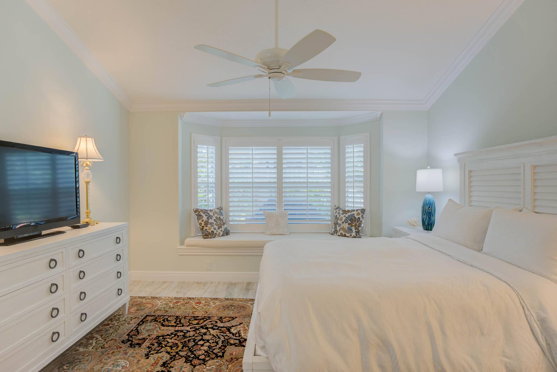 2043 Staysail Lane, Jupiter, Jupiter, FL 33477 Bay window with integrated seating, plantation shutters, crown molding, and ceiling fan