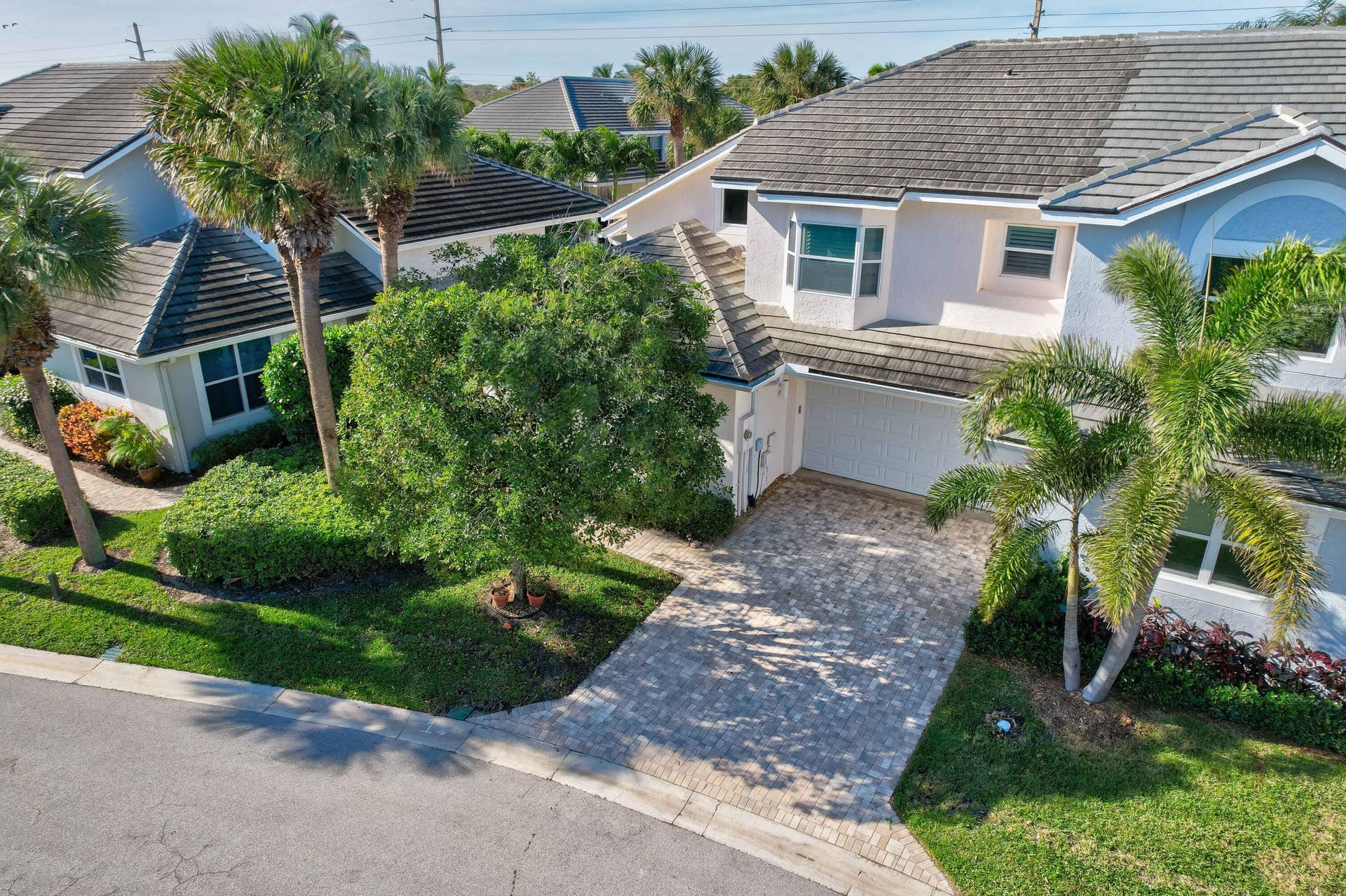 2043 Staysail Lane, Jupiter, Jupiter, FL 33477 Paved driveway leading to a two-car garage
